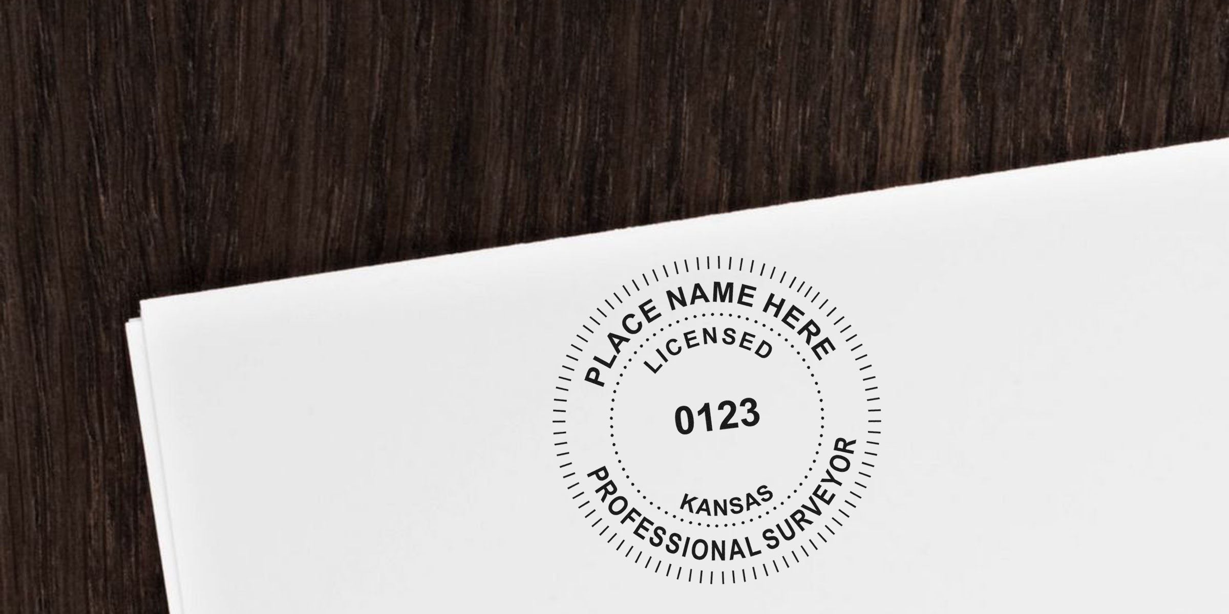Kansas land surveyor seal and licensed professional surveyor stamp on white paper, symbolizing land surveyor certification in Kansas.