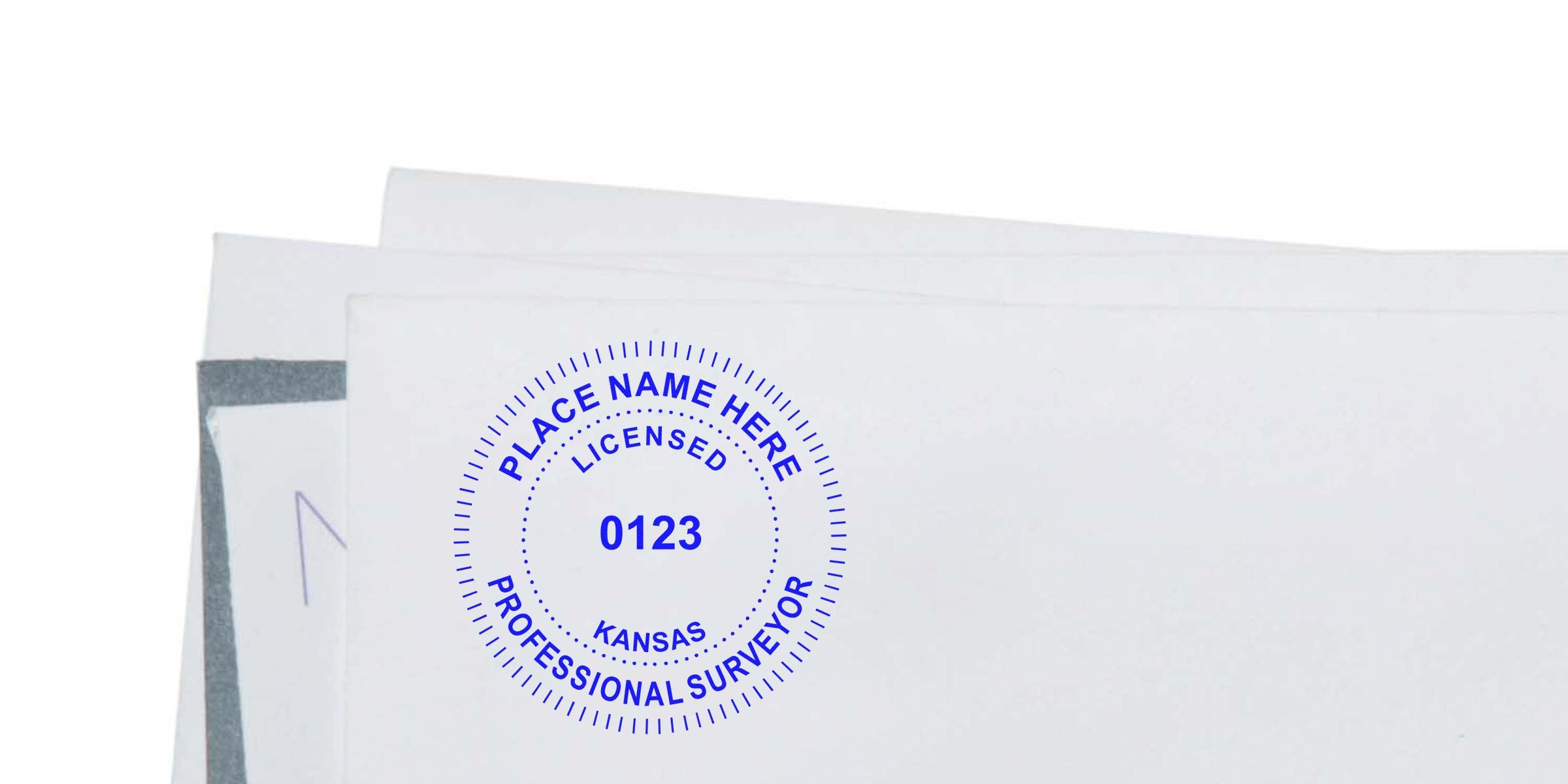 Kansas land surveyor seal stamped on a white paper envelope, displaying a land surveyor seal design.