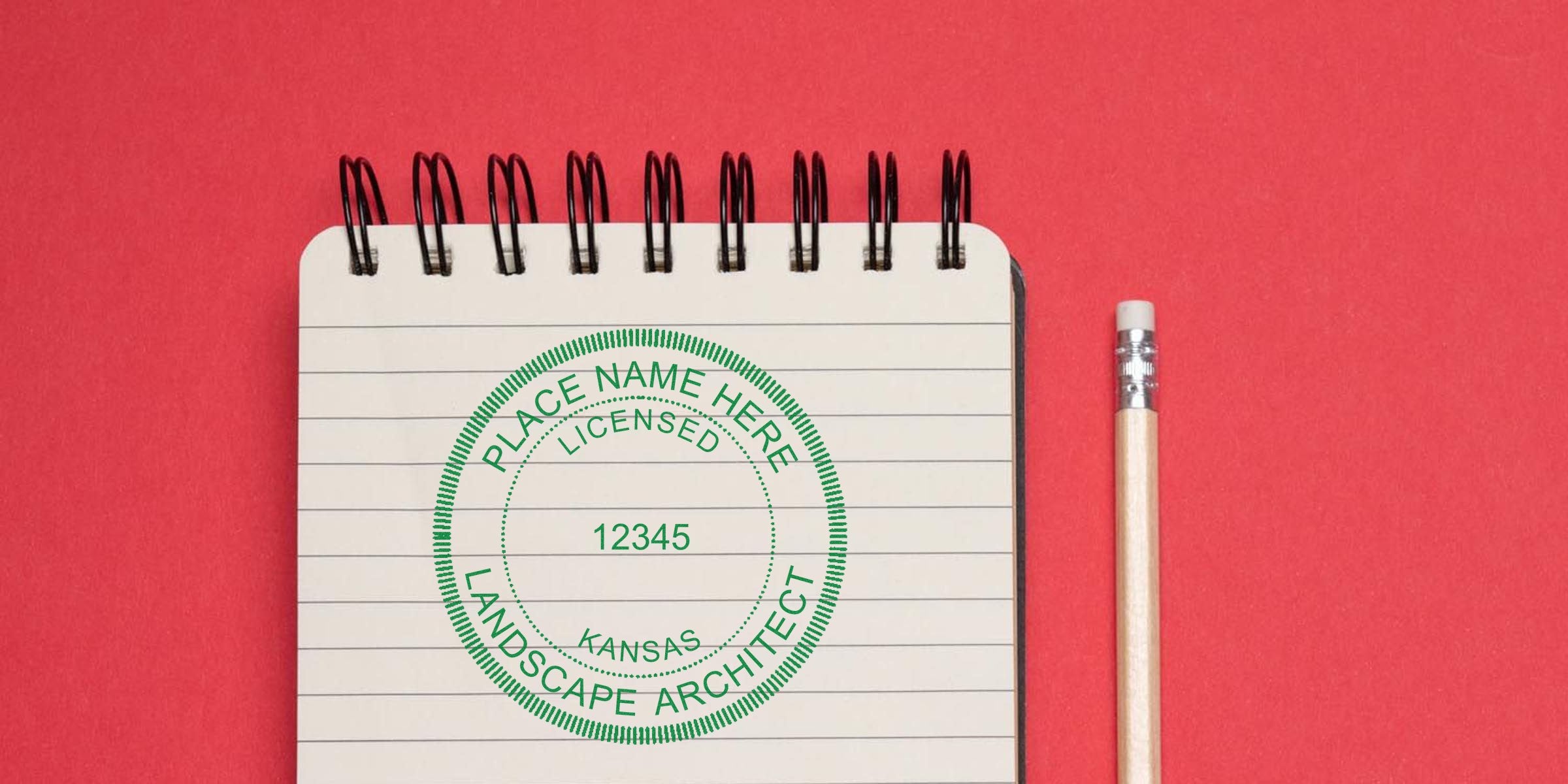 Kansas landscape architect stamp on notebook with pencil, symbolizing Kansas landscape architect licensing on a red background.