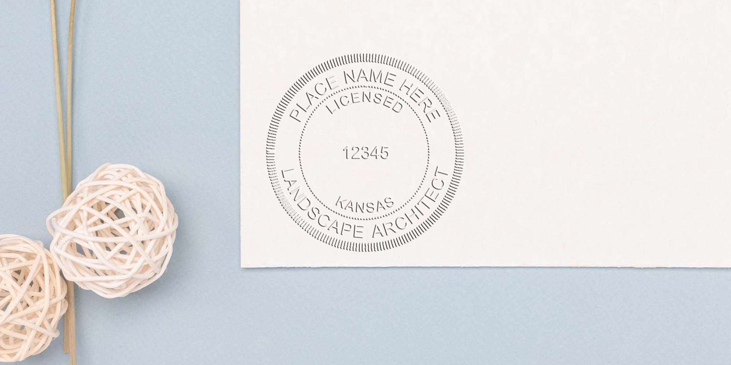 Kansas landscape architect stamp on white paper with decorative rattan balls on a blue background, showcasing an online landscape architect seal.
