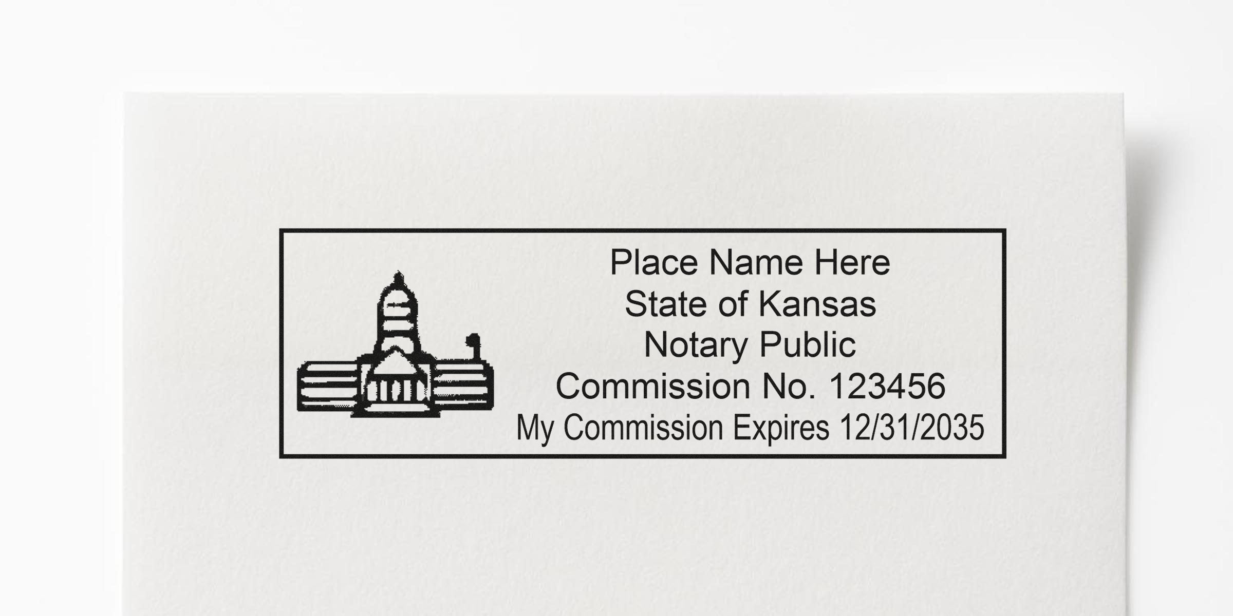 Kansas notary stamp KS with commission number and expiration date on white paper, perfect for your notary stamp guide.