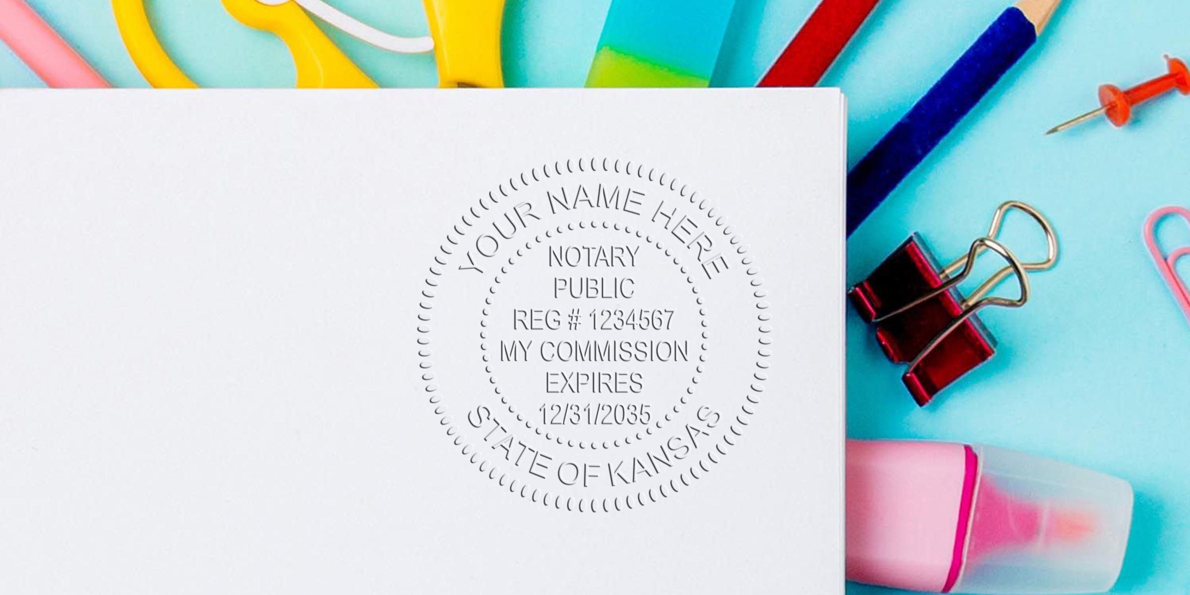 Kansas notary public embossed seal on white paper, surrounded by colorful office supplies, highlighting essential Notary Supplies Kansas and a Kansas Notary Kit.