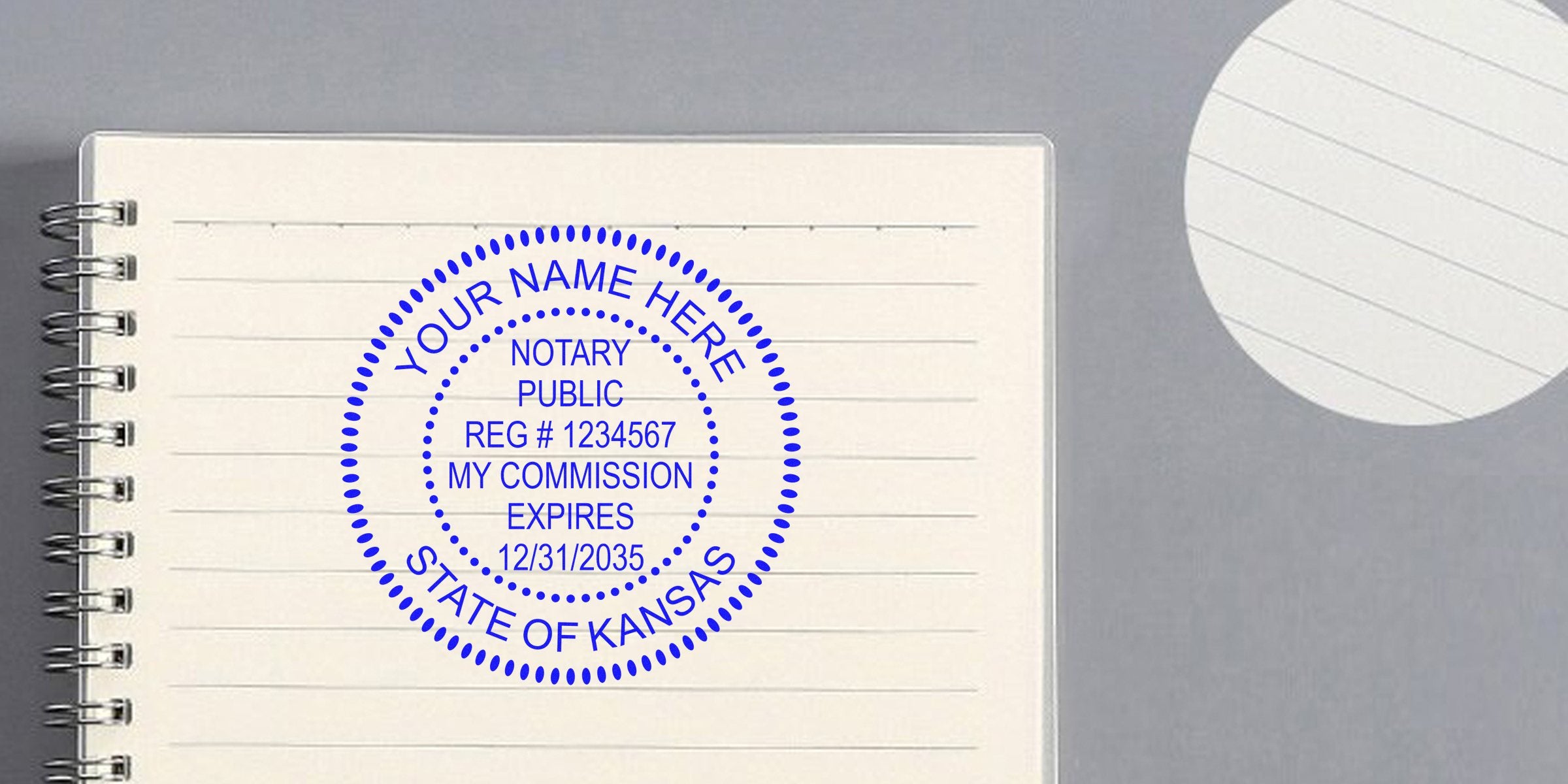 Custom Kansas notary stamp with official seal and commission expiration date on lined notebook page.