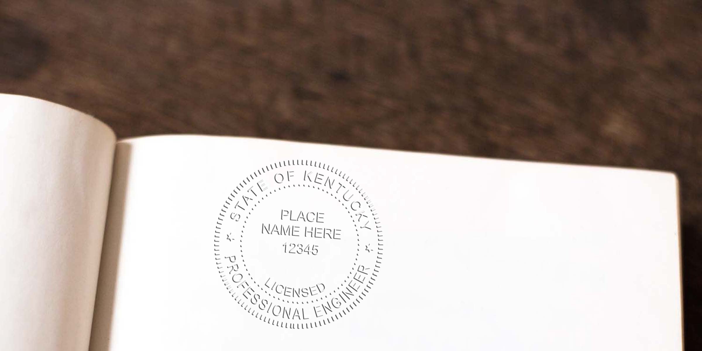 Kentucky Professional Engineer Seal embossed on an open book page with PE Seal Embosser ordering info.