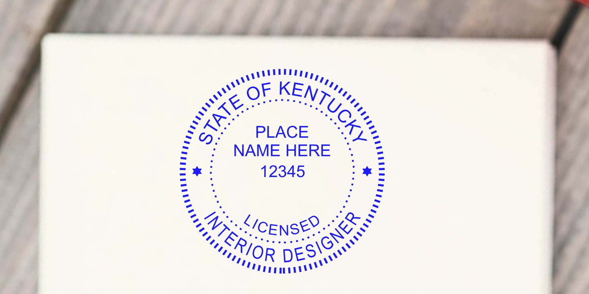 Kentucky interior designer stamp on white paper showing location and license number, complying with interior design stamp requirements.