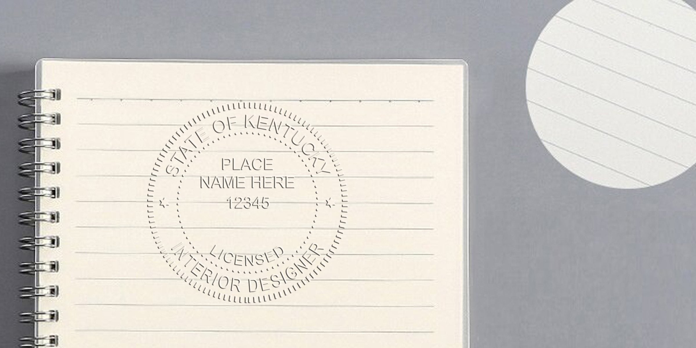 Kentucky interior designer stamp on a spiral notebook, made with a custom online stamp.