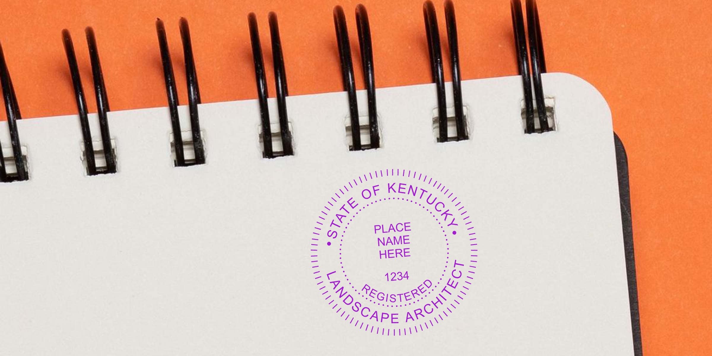 Spiral notebook with Kentucky landscape architect seal on an orange background.