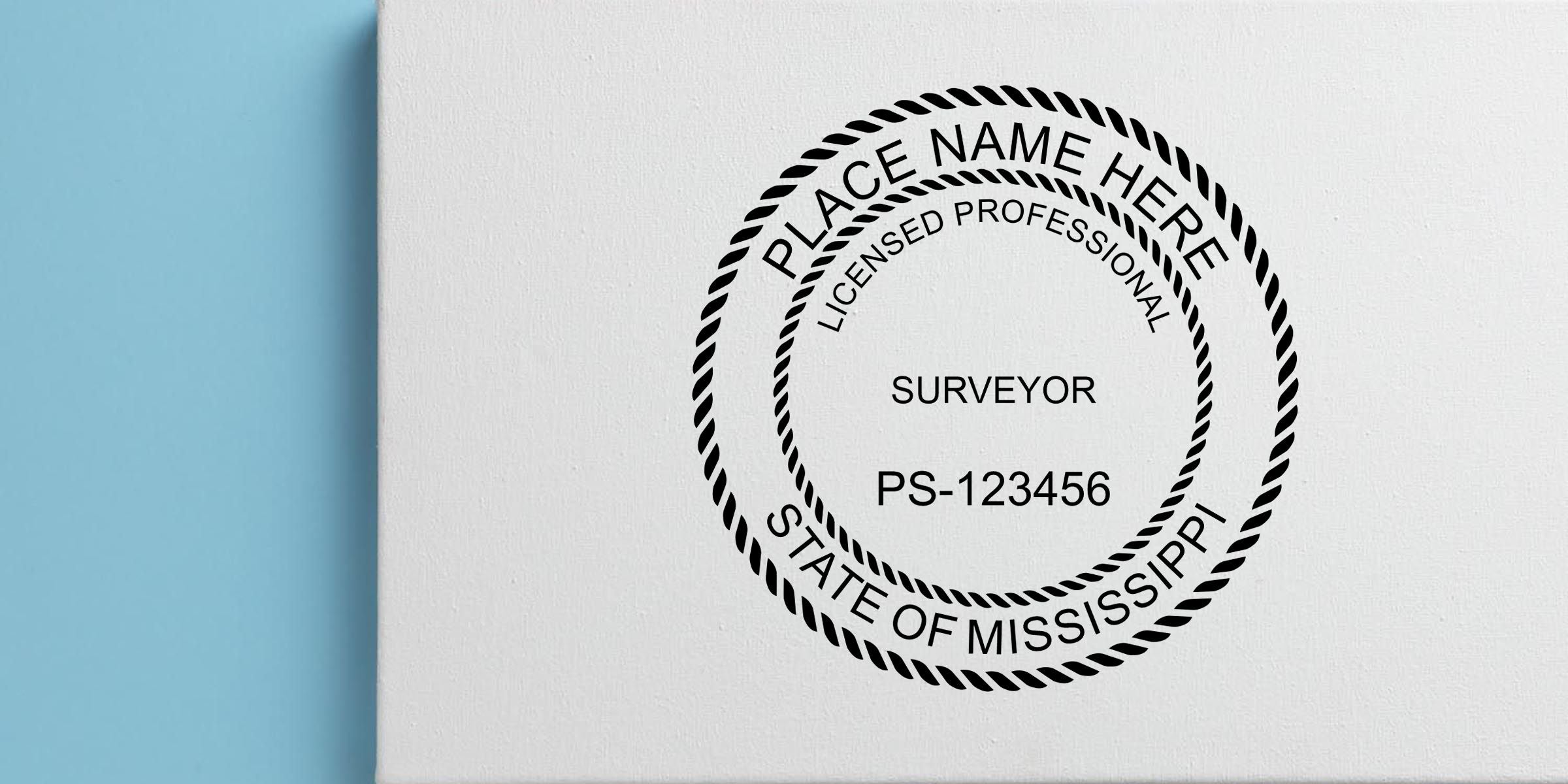 Custom surveyor stamp mockup with “Place Name Here,” “Licensed Professional,” “Surveyor,” PS-123456, and “State of Mississippi” on a white textured background