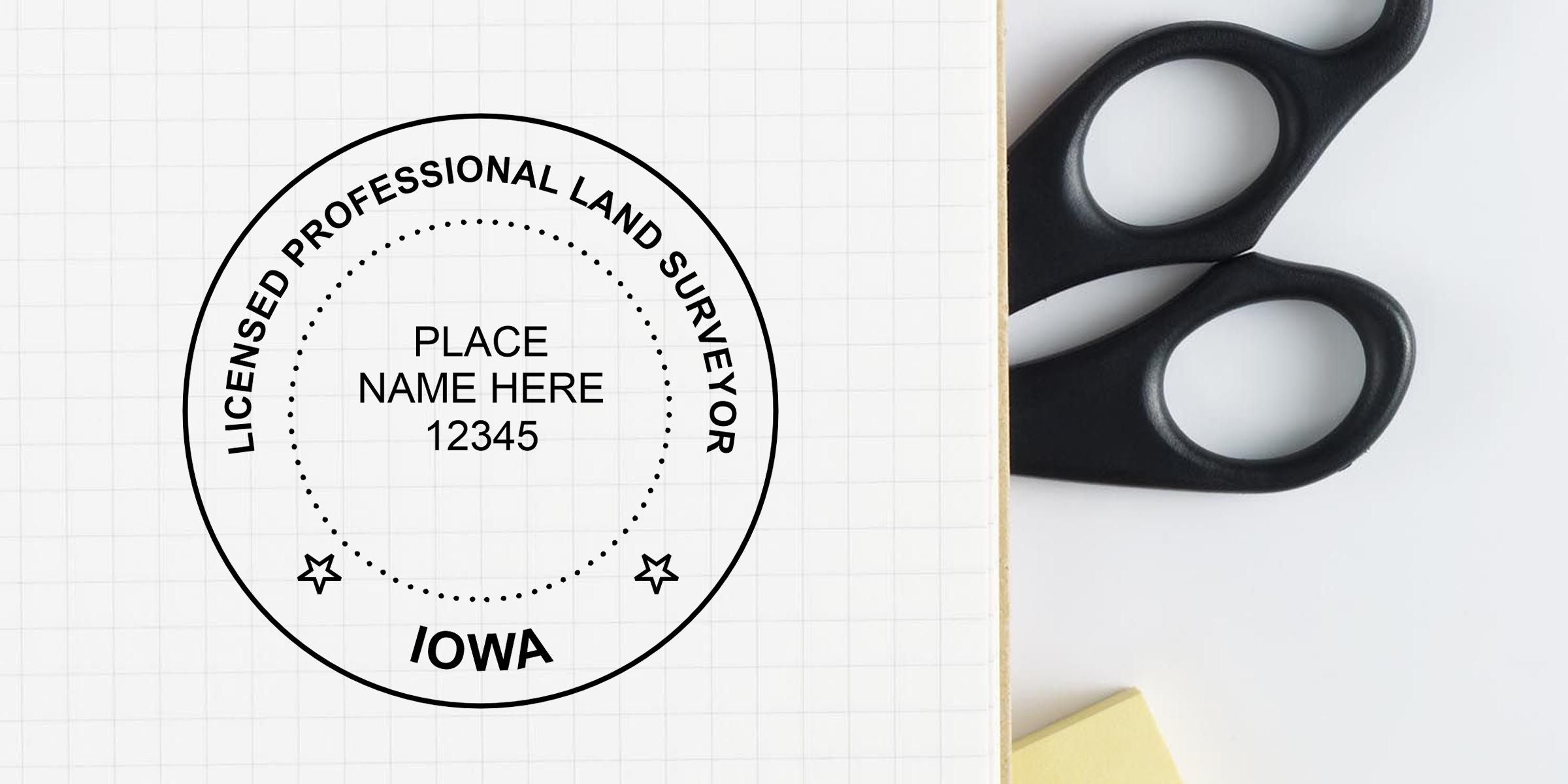 Custom Iowa licensed professional land surveyor seal template with circular stamp design, placeholder name and license number on graph paper next to black scissors