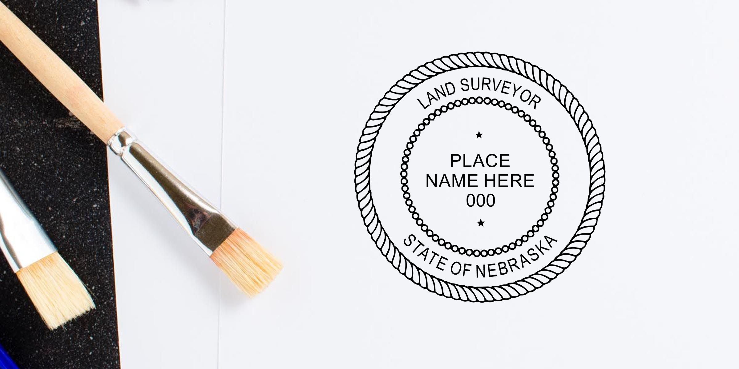 Paintbrushes on white paper beside a custom land surveyor seal logo with “Place Name Here” and “State of Nebraska” text, featuring a circular rope border design