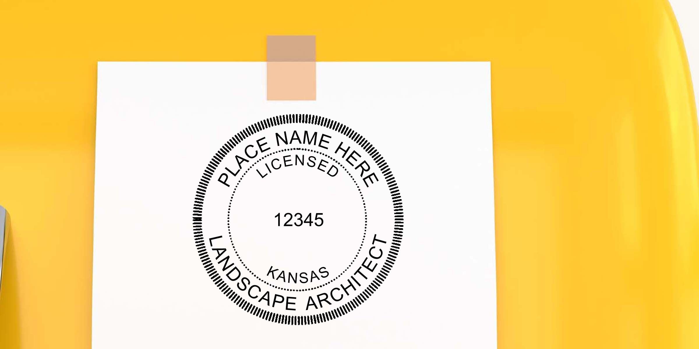 White document with a licensed landscape architect stamp, Kansas, and number 12345 taped on a yellow background