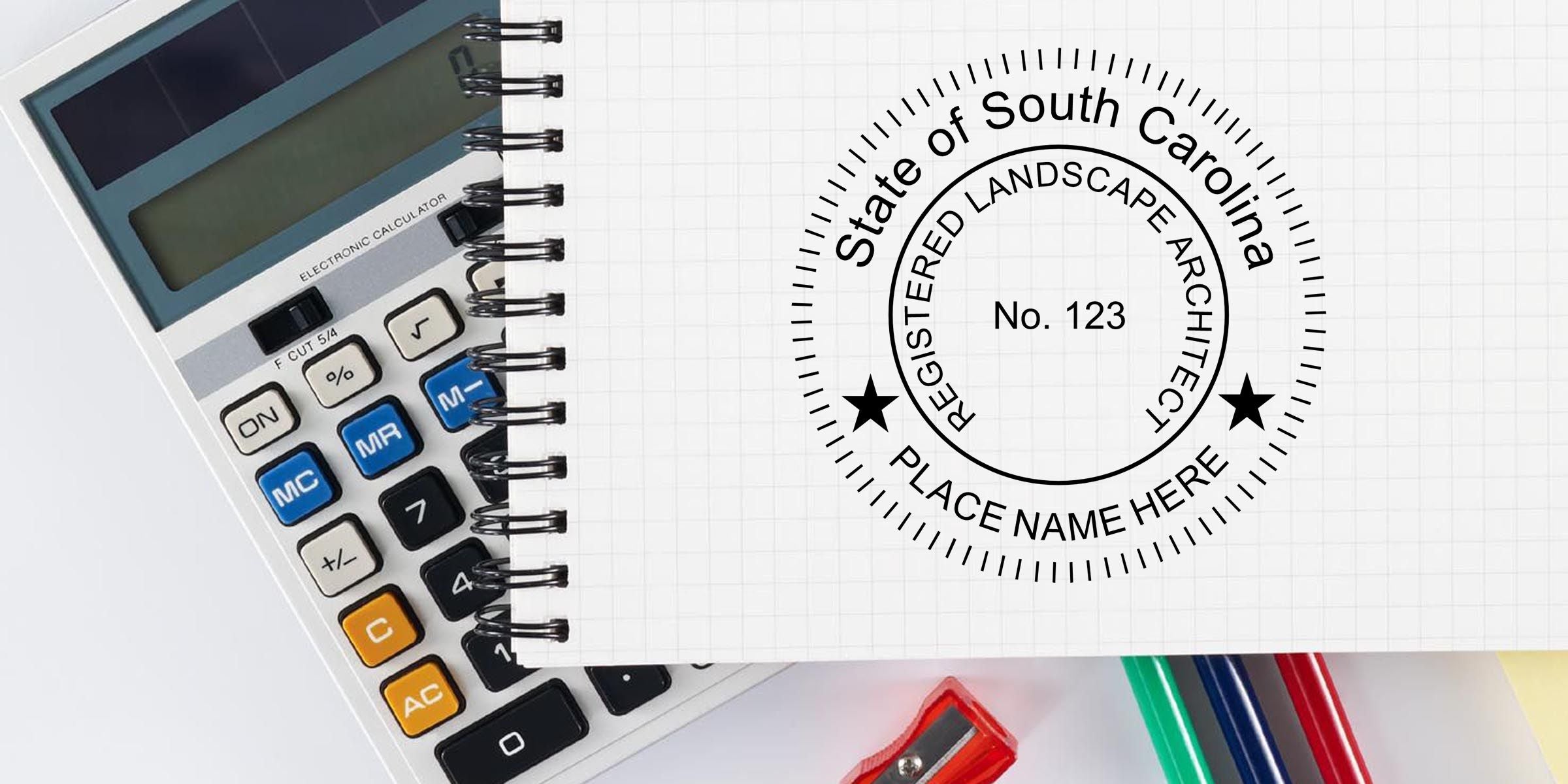 South Carolina registered landscape architect logo on a spiral notebook beside a calculator, pencils, and office supplies, with “No. 123” and “Place Name Here” text on a grid paper background