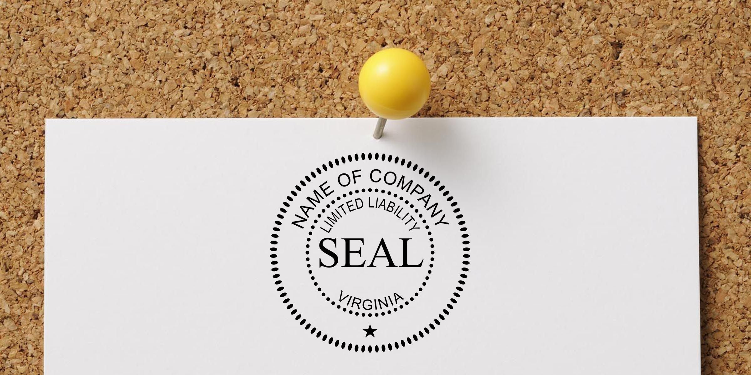 White document pinned to a corkboard with a yellow pushpin, displaying a Virginia limited liability company seal stamp.