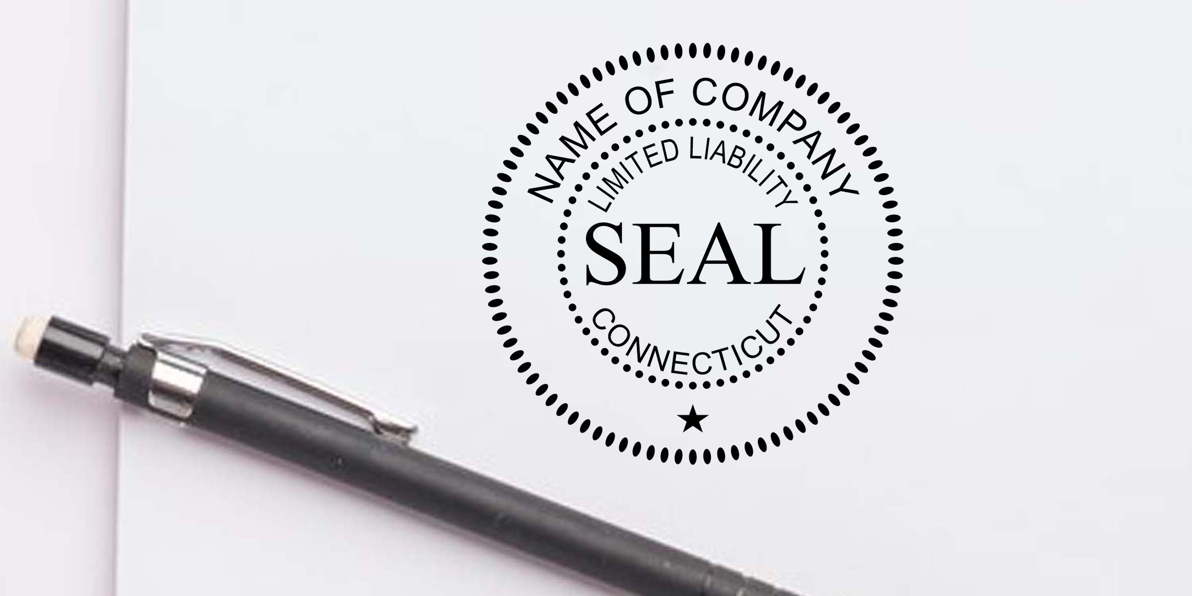Limited liability company seal stamp on business document beside a pen