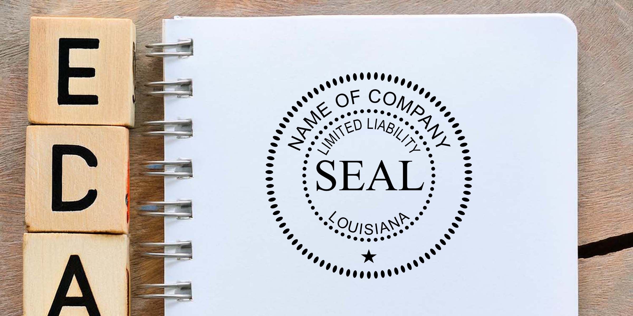 Wooden letter blocks spelling EEA beside a notebook page with a company seal stamp reading limited liability Louisiana.