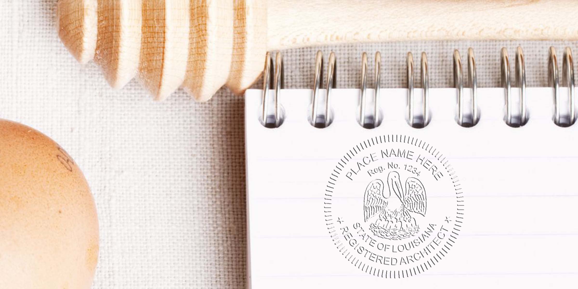 Louisiana architect seal renewal shown on spiral notebook with wooden honey dipper and egg on linen, next to architect license checklist.