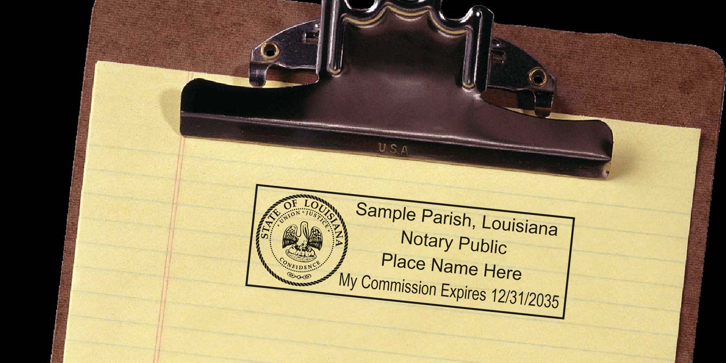 Louisiana notary public stamp on yellow legal pad with clipboard showing official seal, expiration, and renewal details.