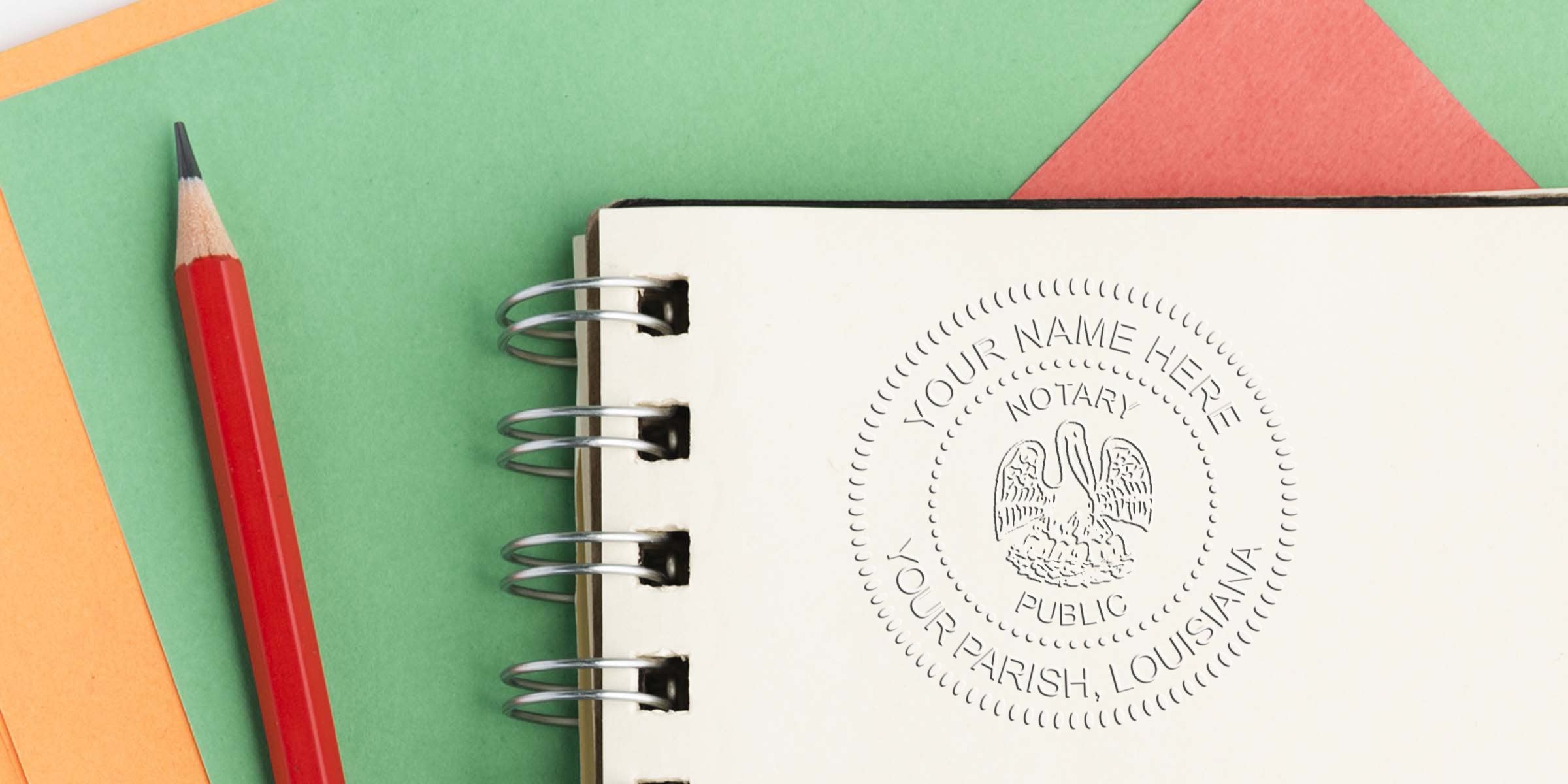 Louisiana notary starter kit with a notary public embossed seal on a notebook, accompanied by a red pencil on a vibrant paper background.