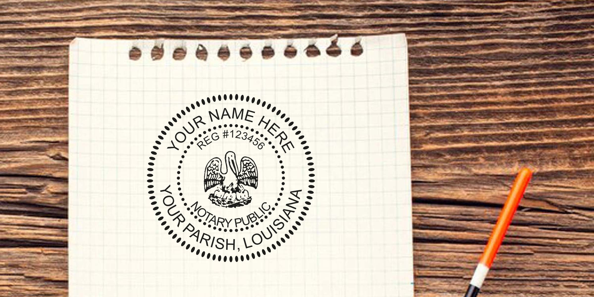Custom Louisiana notary seal design on graph paper with wooden background and orange pen, meeting all Louisiana notary seal requirements.