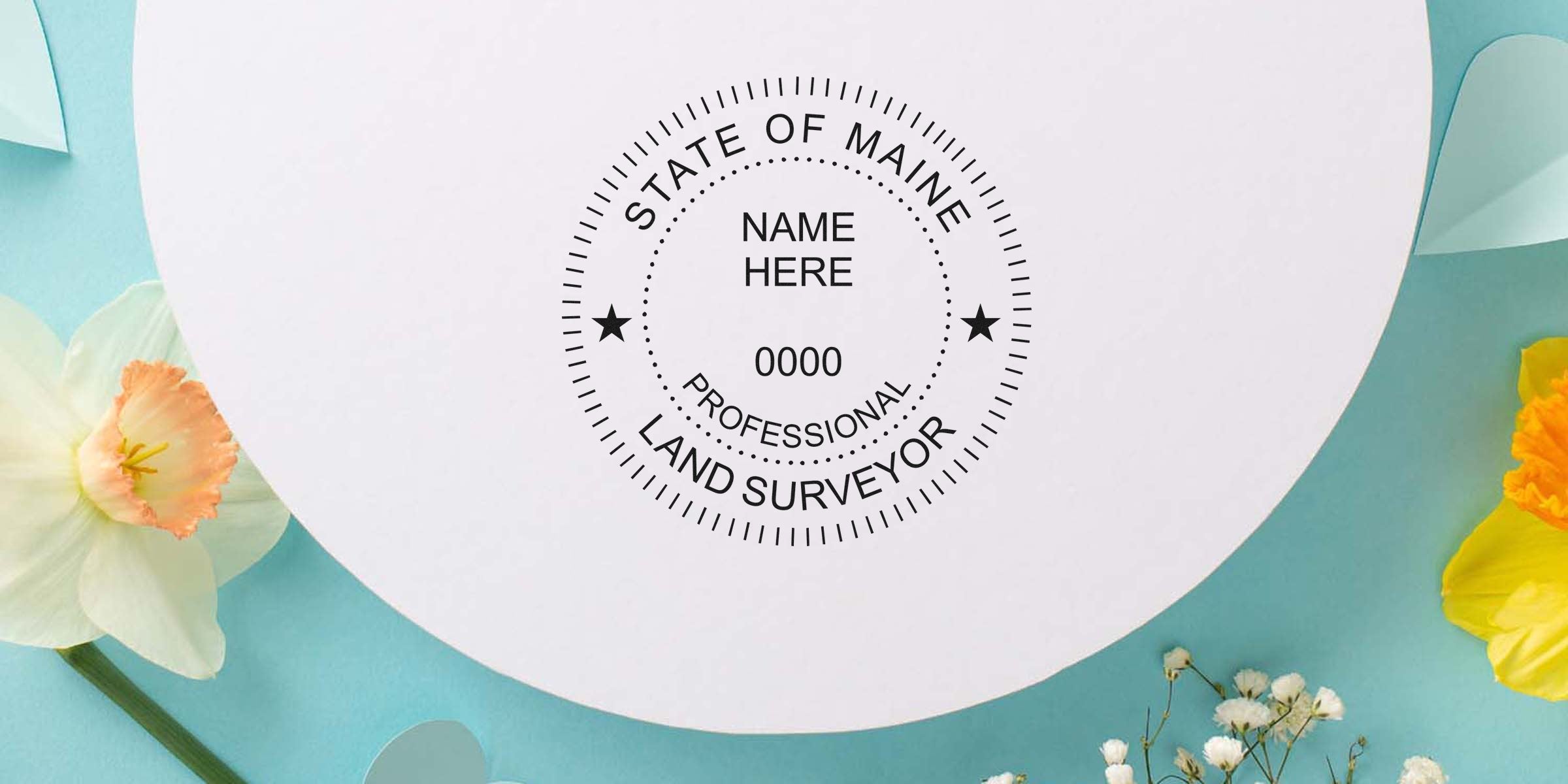 Custom Maine land surveyor seal on white paper with flowers on blue background, symbolizing professional land surveying in Maine.