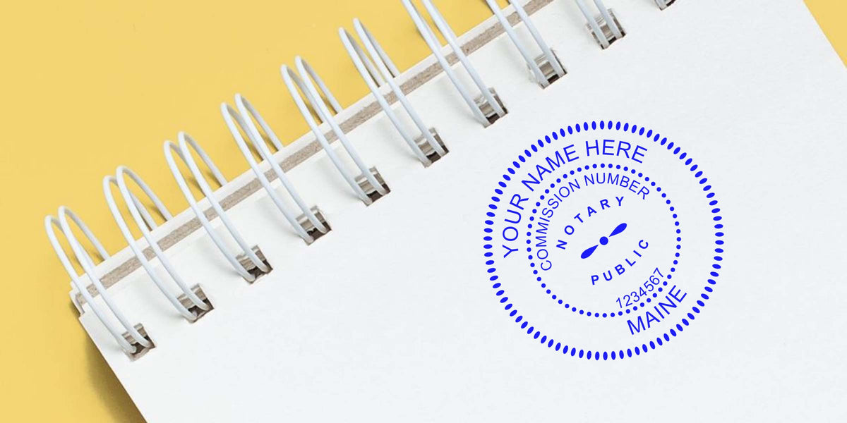 Custom Maine notary stamp on spiral notebook for commission number verification, meeting Maine notary stamp rules, perfect for new notaries guide.
