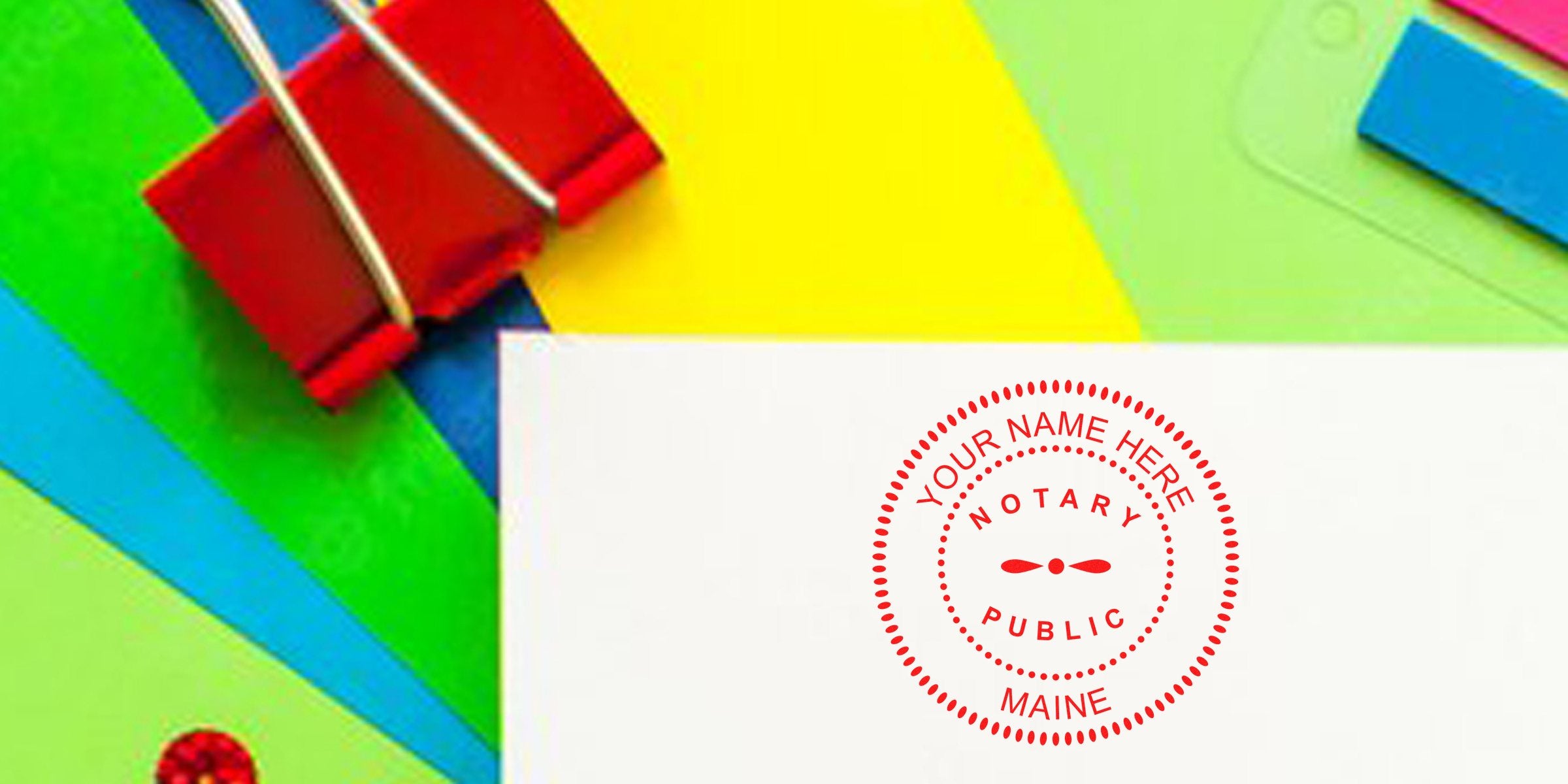 Custom Maine notary stamp on white paper with colorful supplies background, personalized Maine notary seal for official documents.