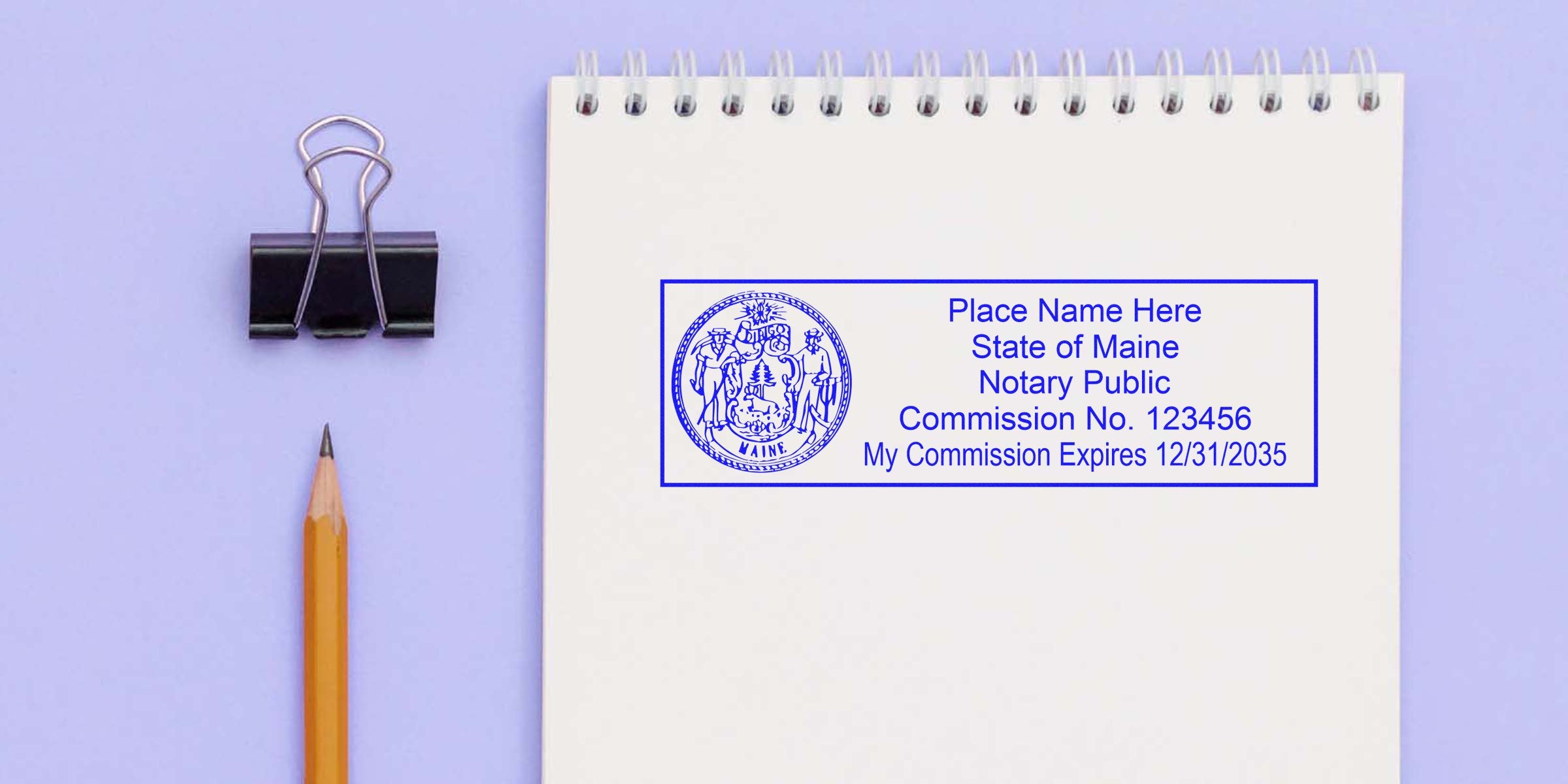 Maine notary seal stamped on white notepad with pencil and binder clip on purple background, representing Maine notary public guidelines.