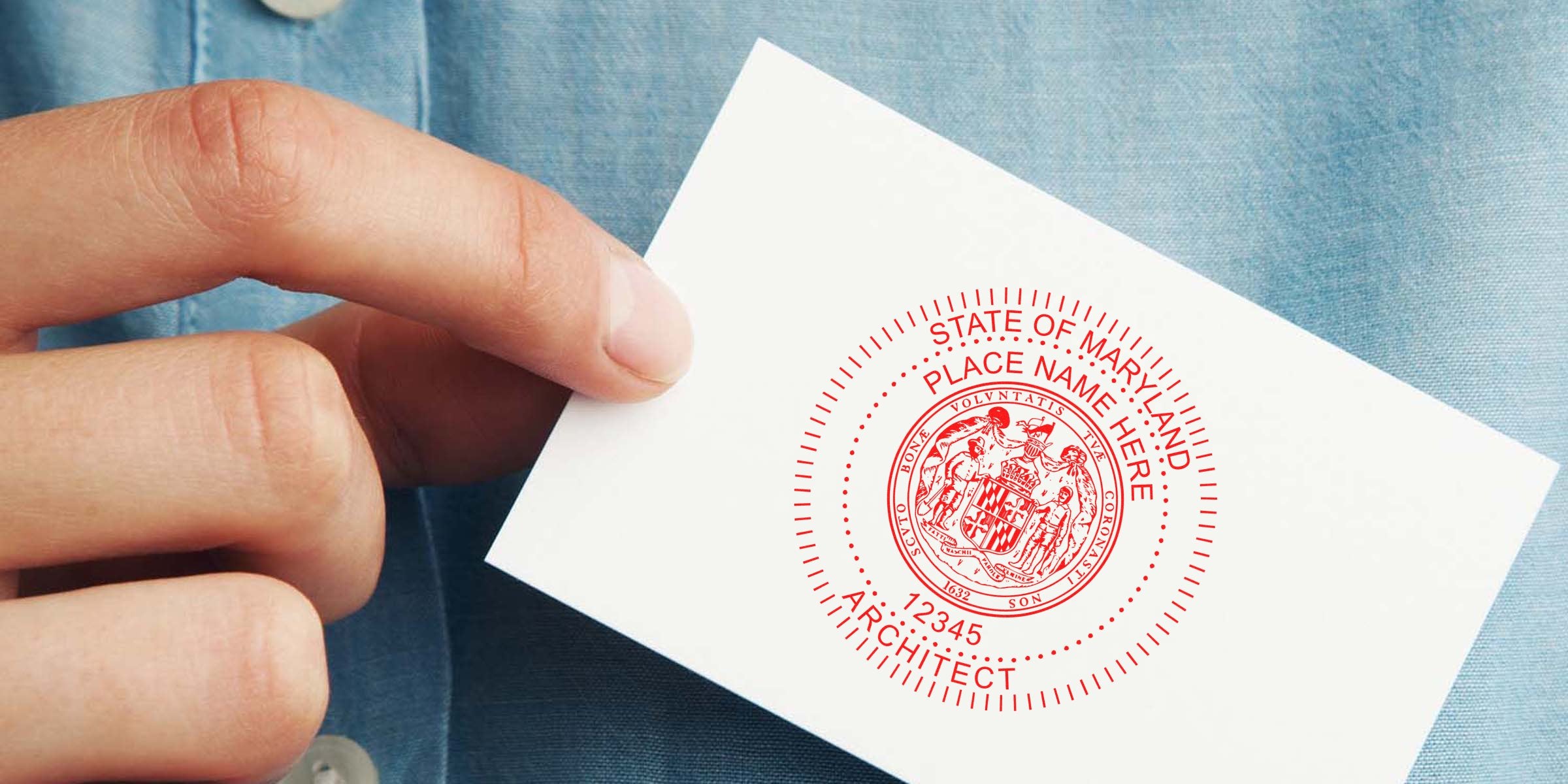 Hand holding affordable Maryland architect stamp on white card, highlighting the cost of professional certification.