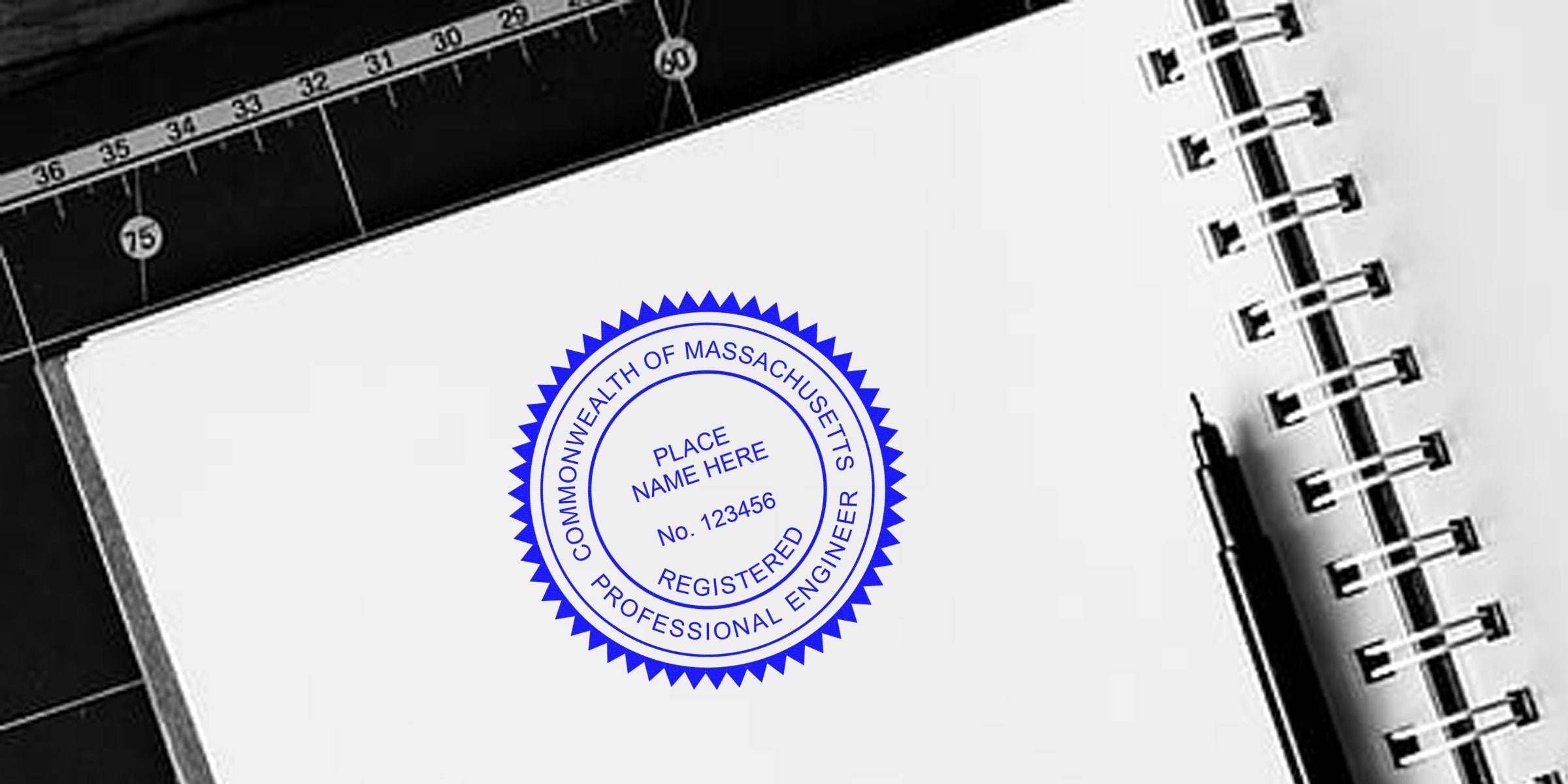 Registered professional engineer seal on notebook with pen and ruler, displaying Massachusetts PE stamp size and compliance with Massachusetts PE stamp requirements.