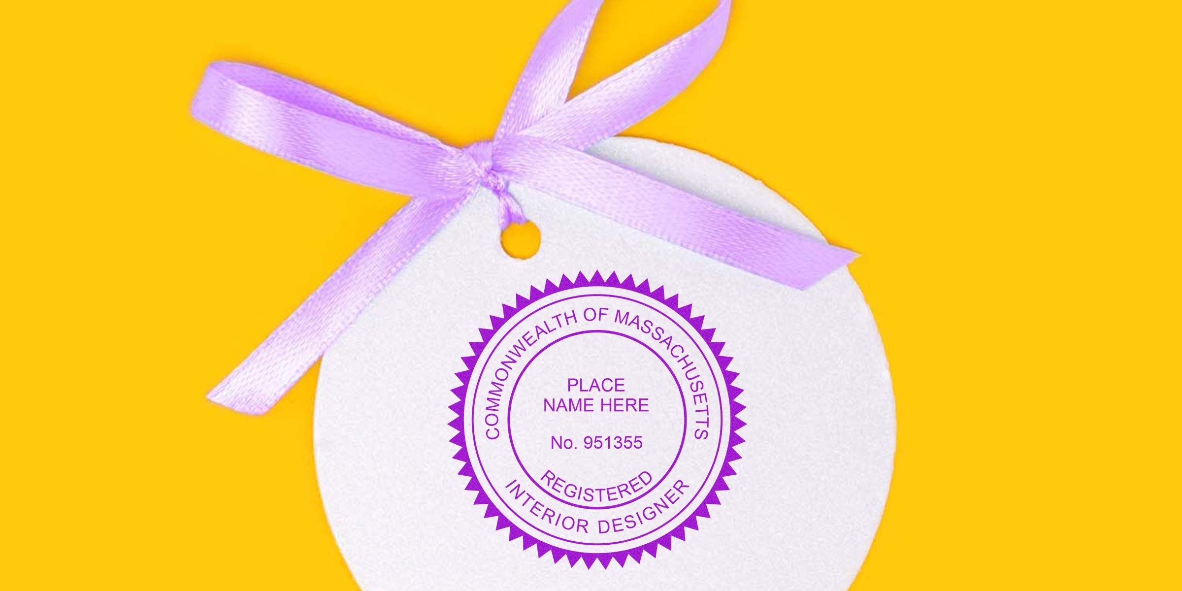 Massachusetts interior designer seal with a purple ribbon on a yellow background, featuring stamp design ideas.
