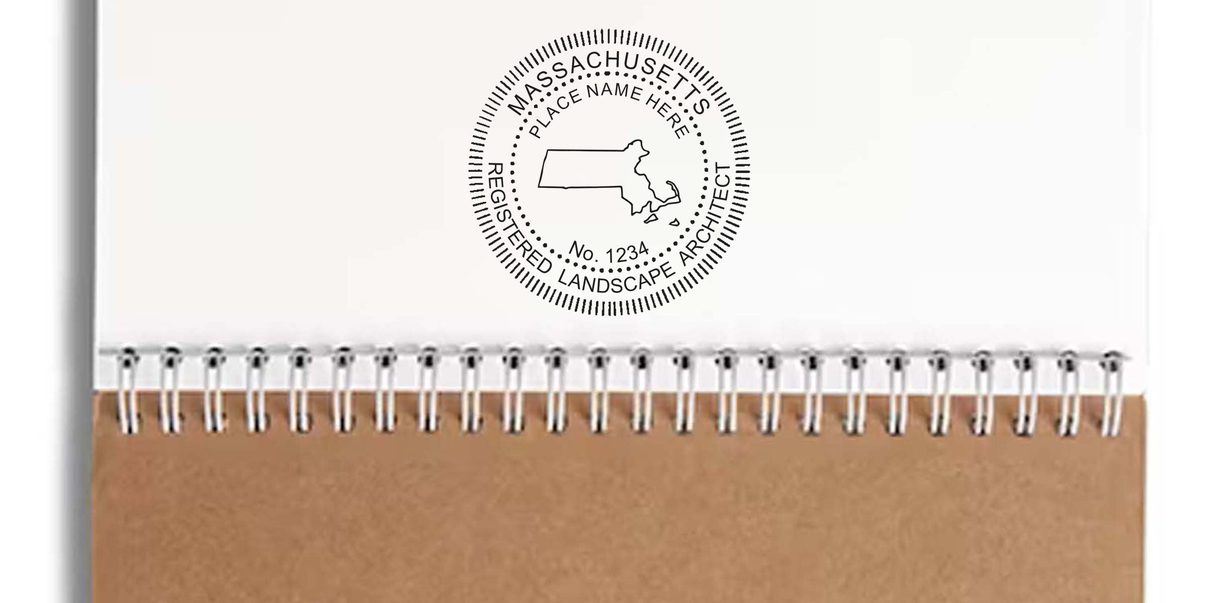 Massachusetts landscape architect stamp on a brown spiral notebook, showing the landscape architect seal and supplies.