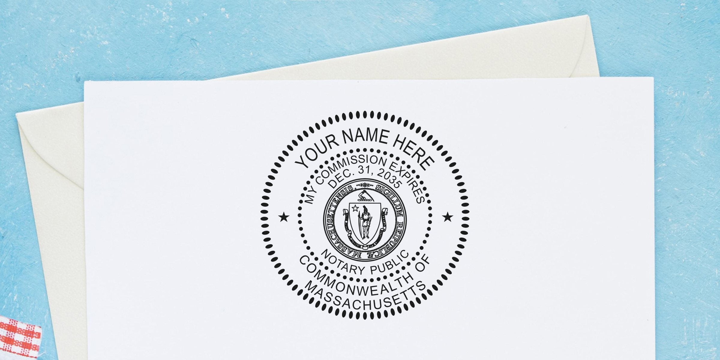 Massachusetts notary public stamp on white paper showing commission expiration date, part of a notary kit with Massachusetts starter essentials.