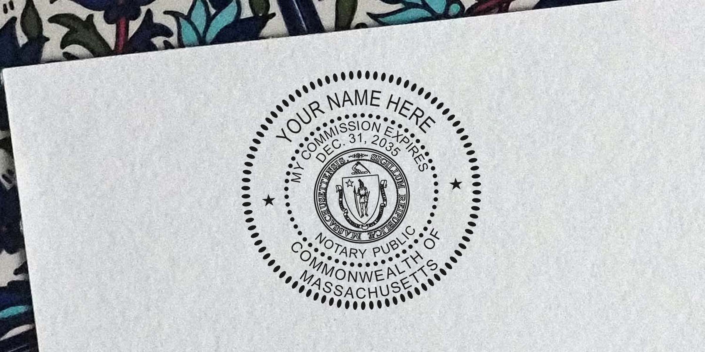 Massachusetts notary stamp on white paper showing commission expiration date in the official Massachusetts notary format.