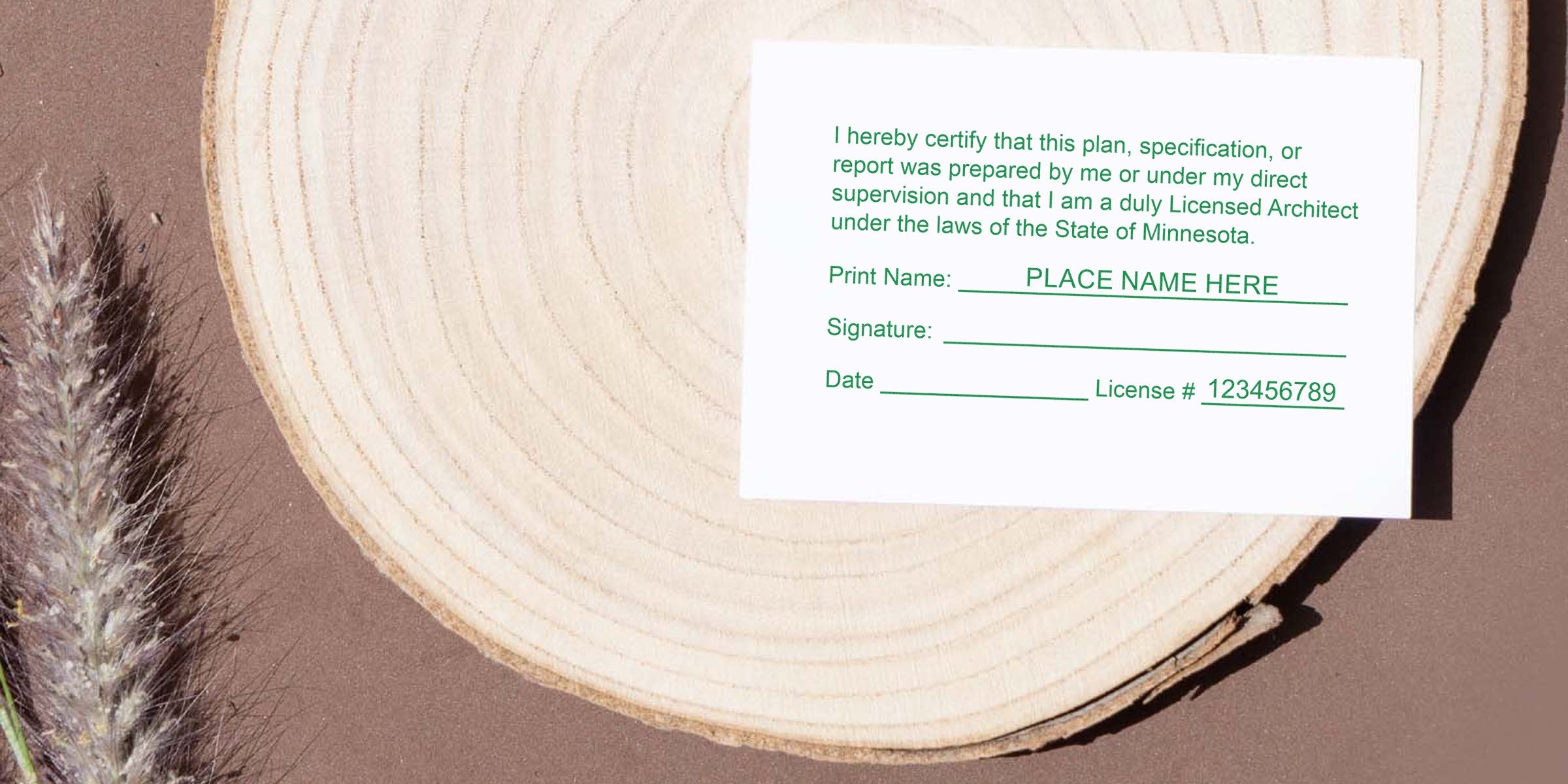 Licensed architect certification card on wood background with nature elements, showing Minnesota architect stamp size and specifications.