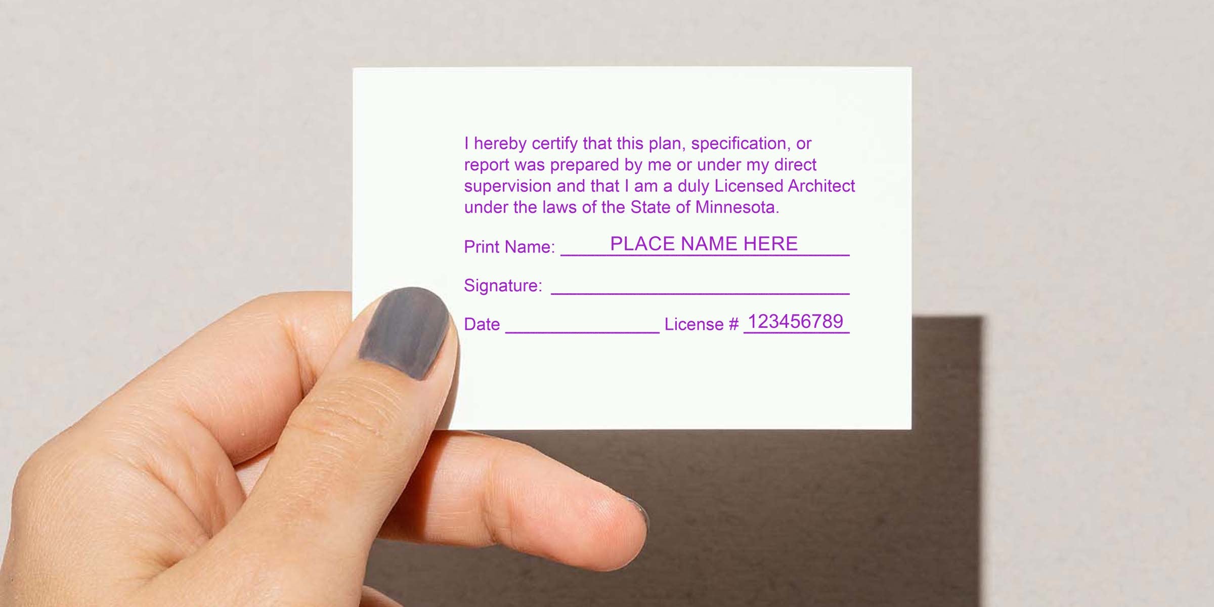 Hand holding a Minnesota architect certification card showing signature and license number, complying with architect stamp guidelines for architectural services.