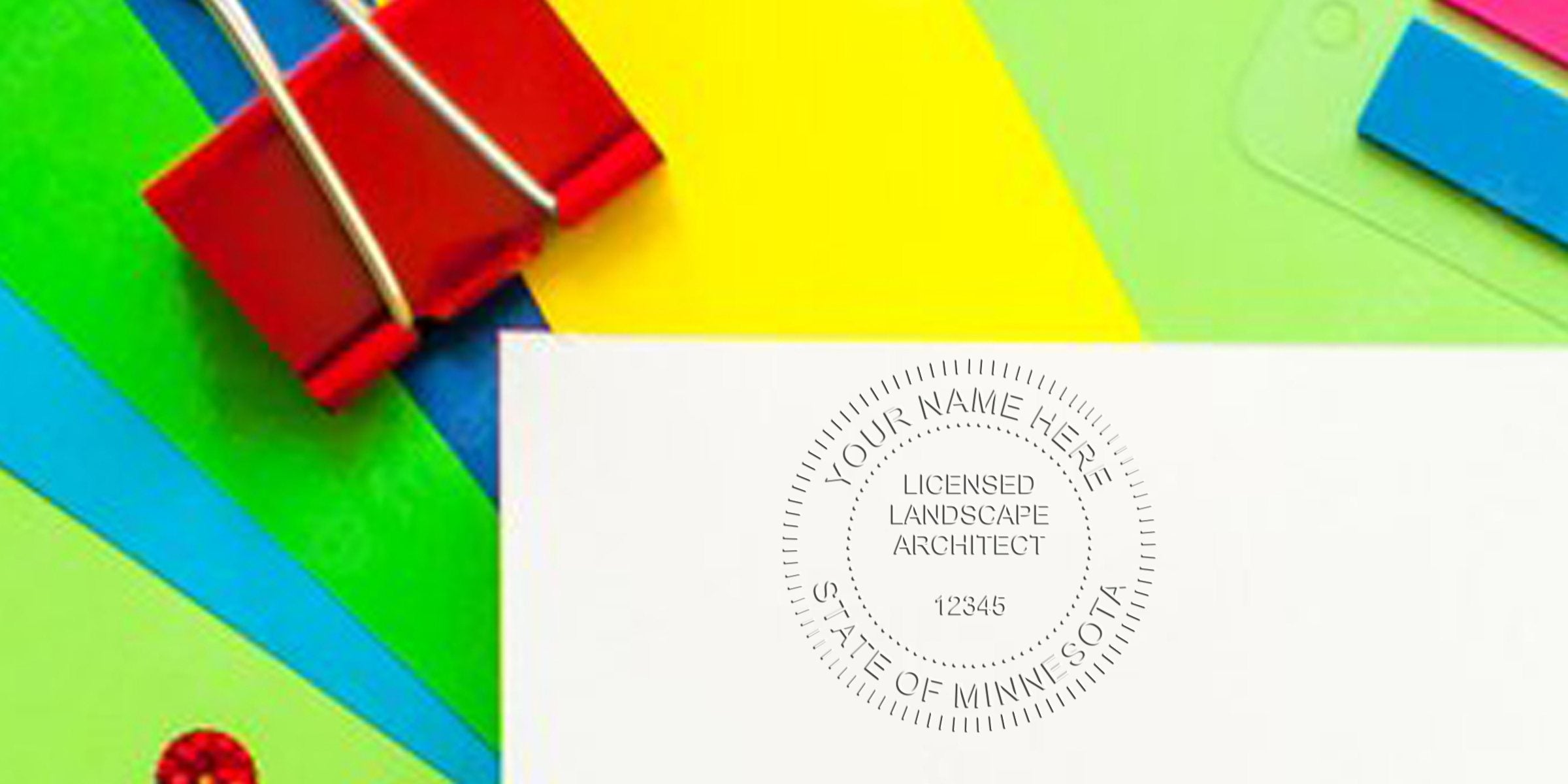Red binder clip holds colorful paper with the Minnesota Landscape Architect Seal and details on certification requirements.
