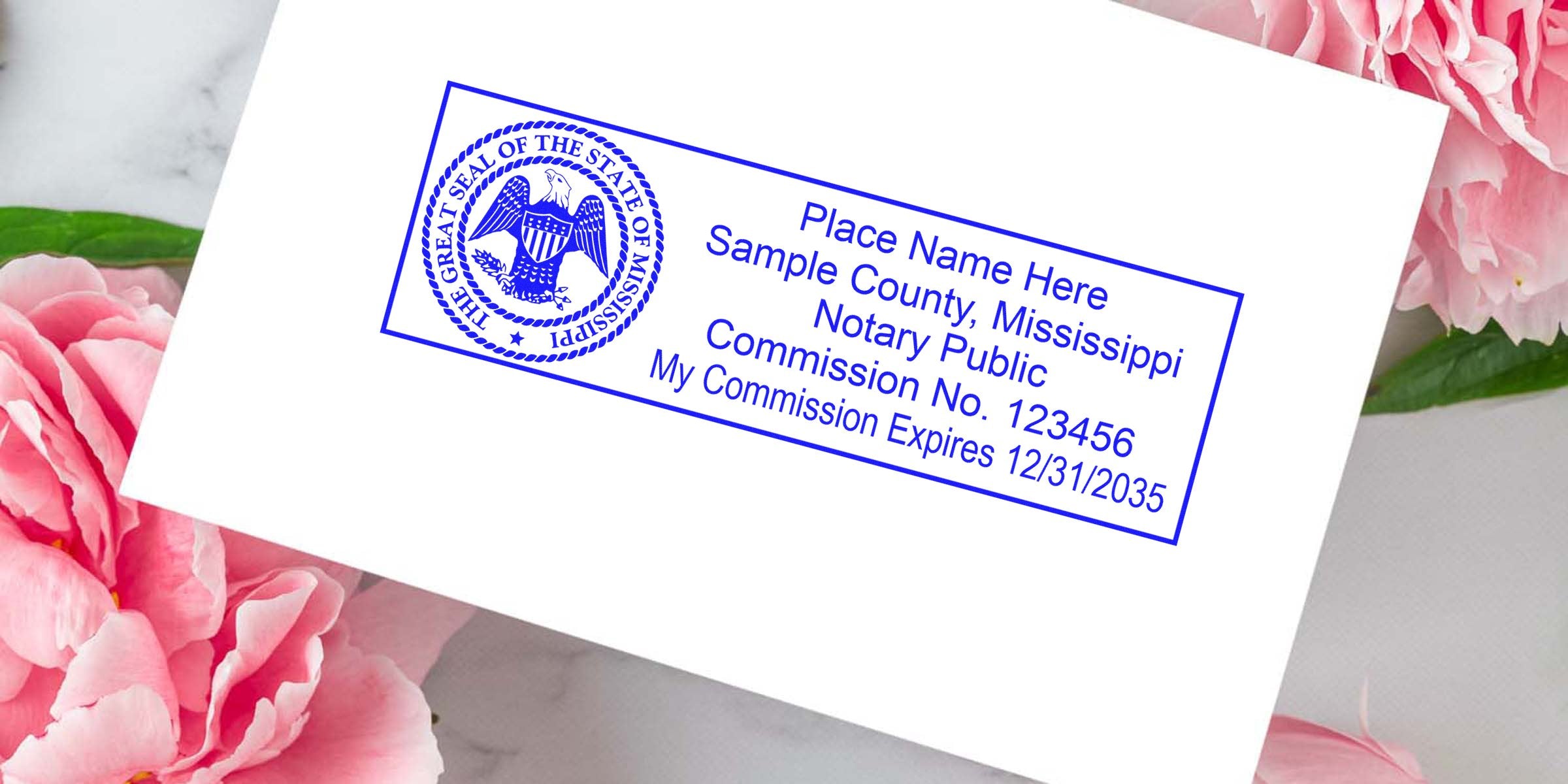 Mississippi notary stamp with commission number and expiration date on white paper, featuring a self-inking design, surrounded by pink flowers.
