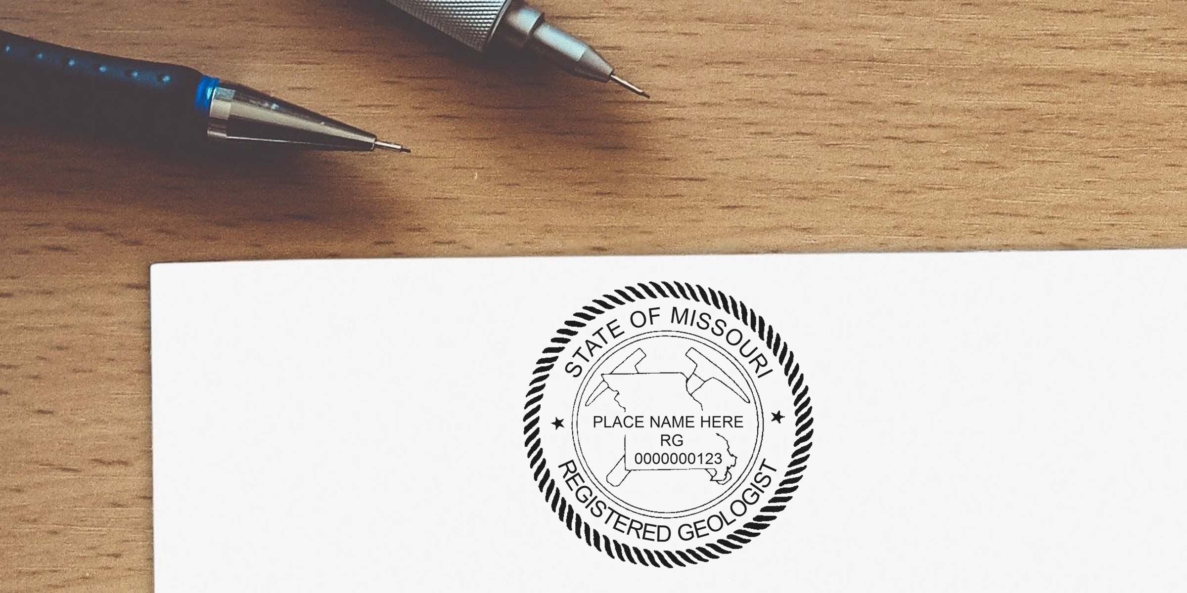 Missouri Geologist Stamp on white paper with mechanical pencils on wooden desk, displaying Missouri Geologist Stamp Requirements.