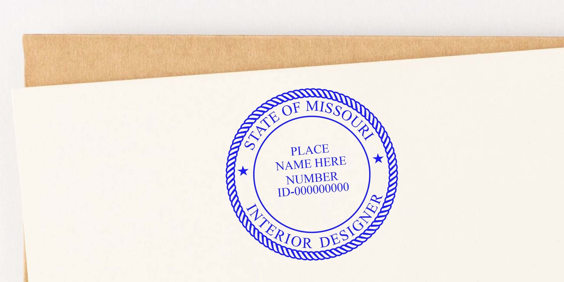 Missouri interior designer’s self-inking stamp on paper showing place name and ID number, demonstrating how to use a self-inking stamp.