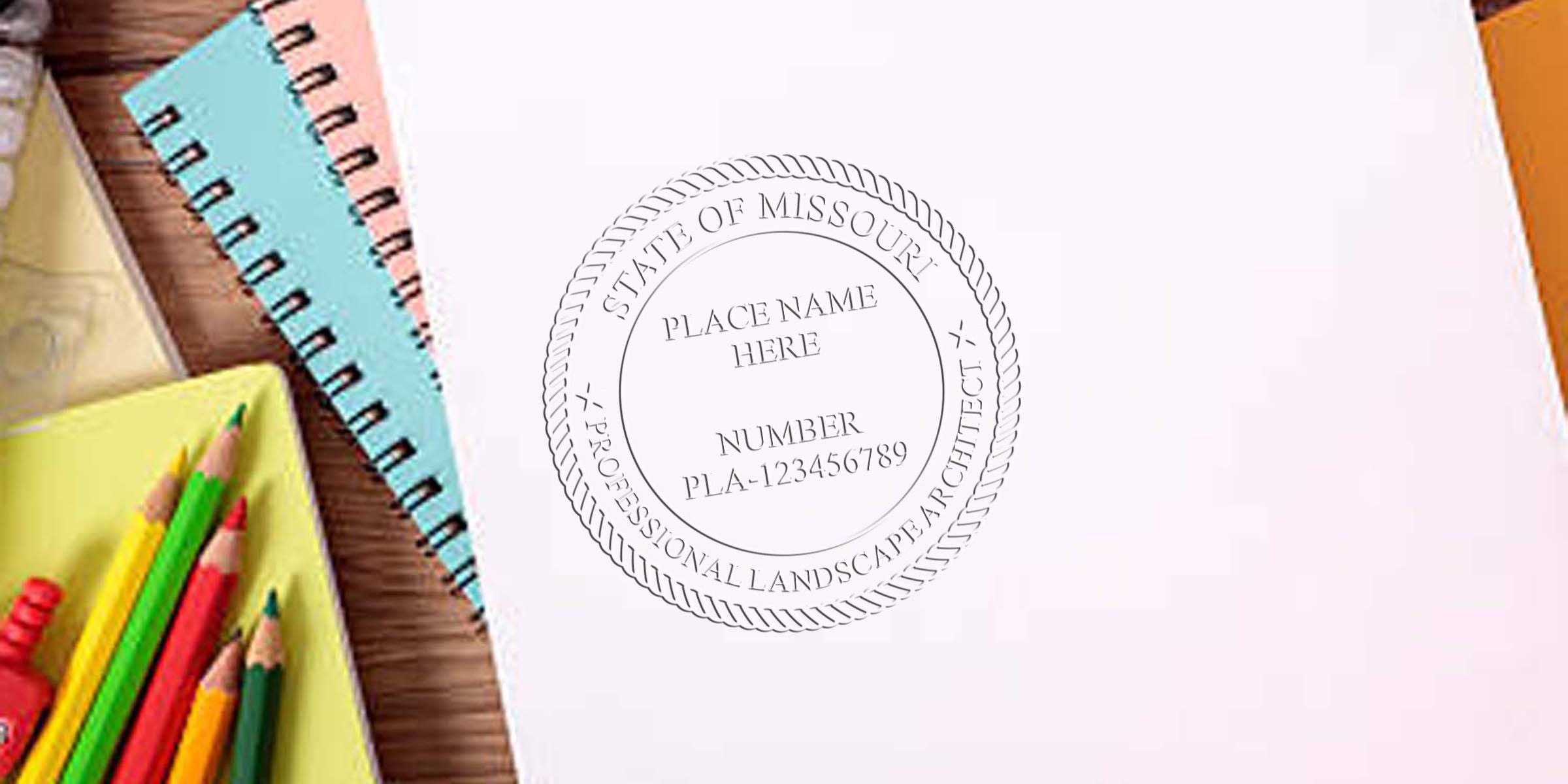 Missouri landscape architect stamp on white paper with colored pencils and notebooks on a wooden desk, showing common mistakes made when buying landscape architect stamps.