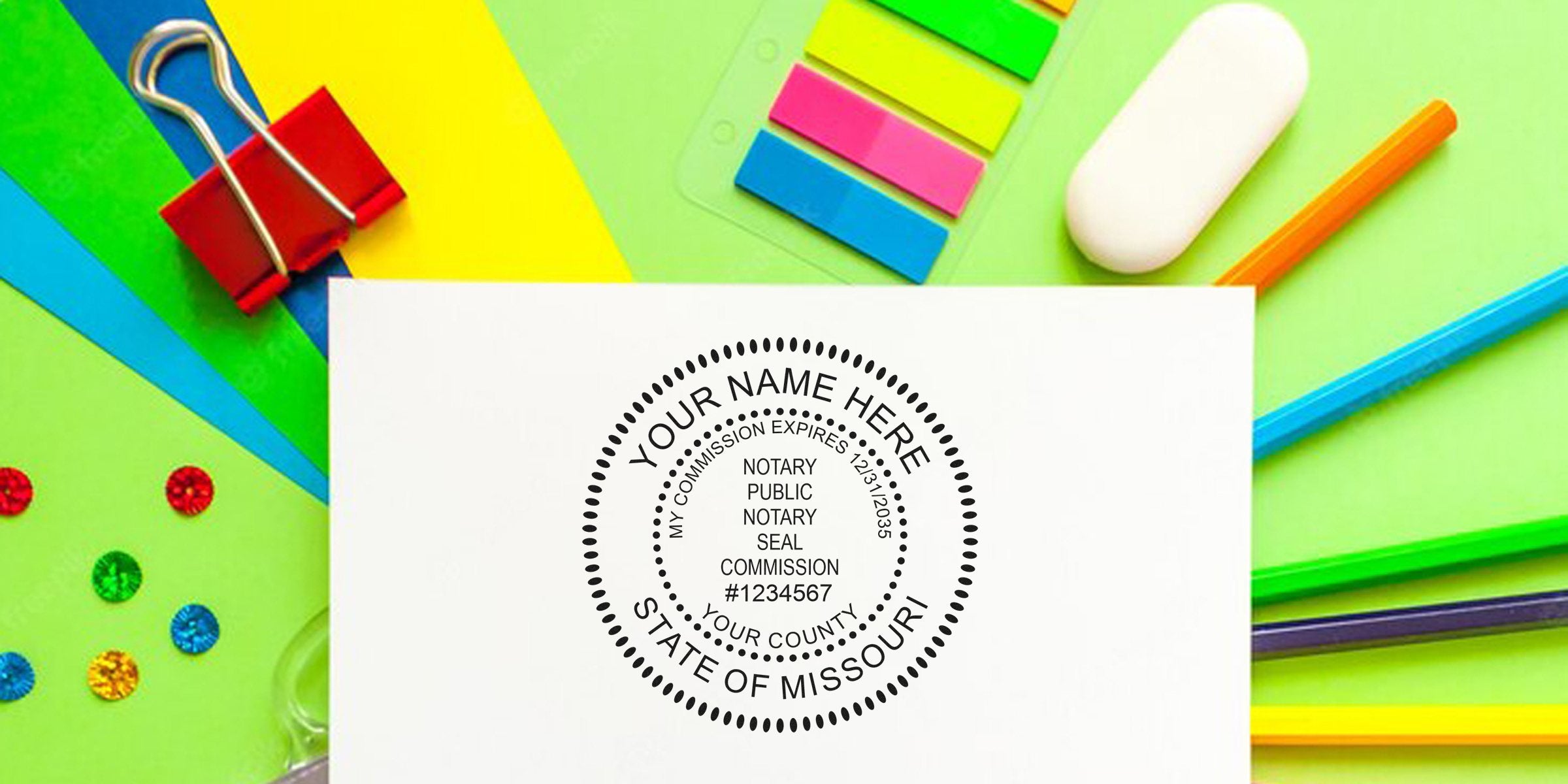 Custom Missouri notary stamp on white paper, surrounded by vibrant office supplies, showcasing the top notary tools Missouri provides.