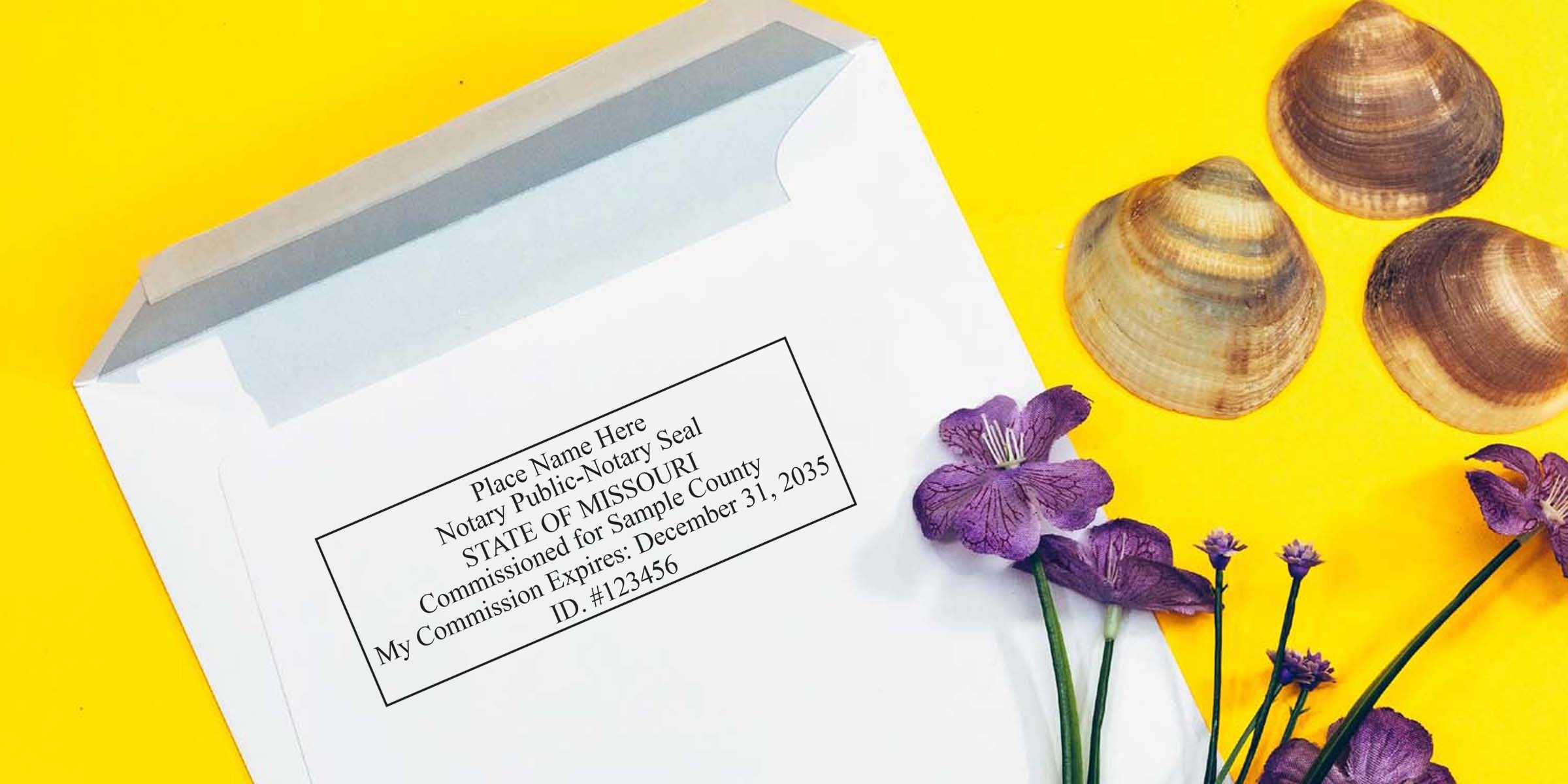White envelope with Missouri Notary Seal stamp on yellow background, decorated with purple flowers and seashells, showing commission seal expiration date; includes tips for buying a Notary Seal.