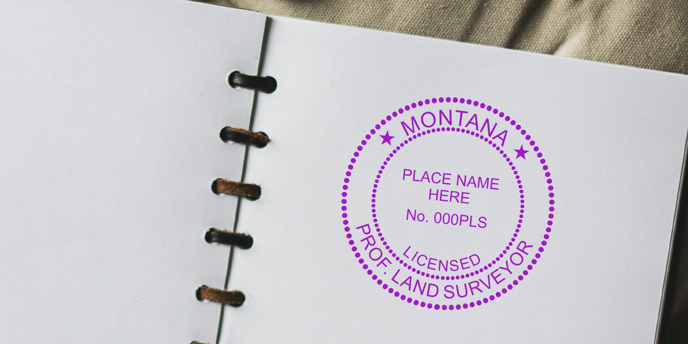 Montana Surveyor Seal stamped on notebook page showing best practices for land surveying services.