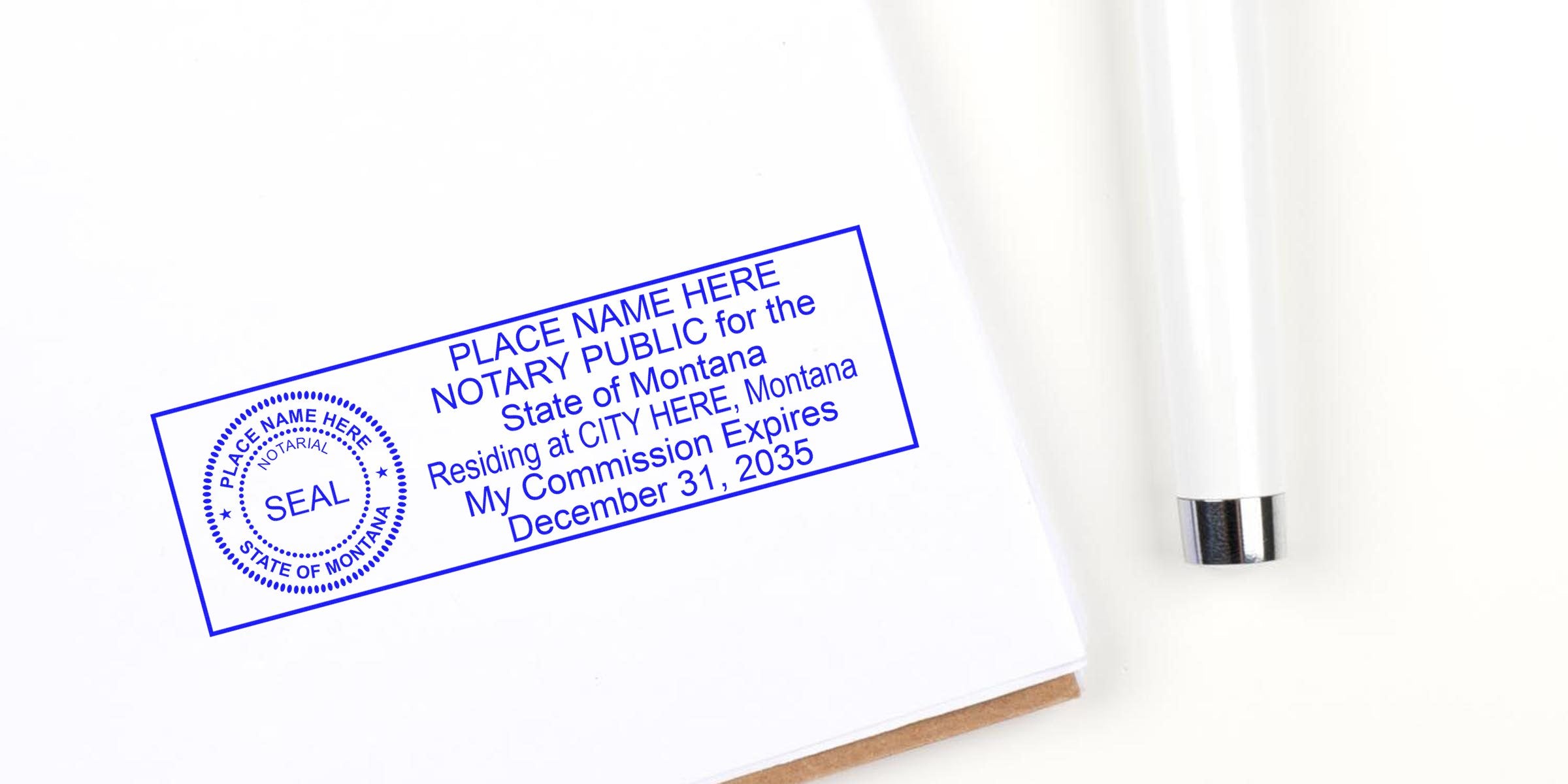 Montana notary stamp with commission expiry on white paper next to a white pen, emphasizing Montana notary stamp and online notary services.