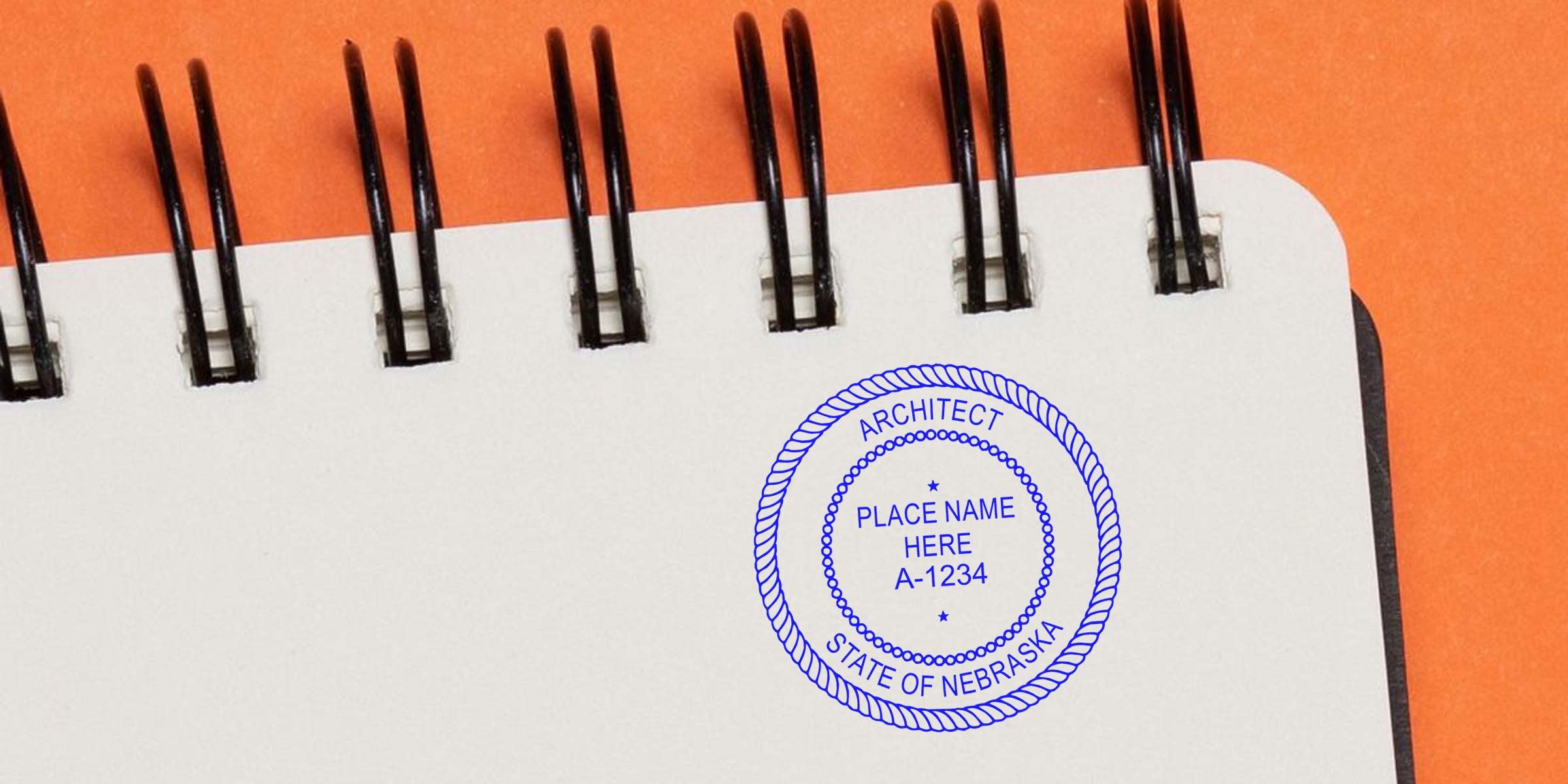 Nebraska architect seal stamped on a spiral notebook with an orange background, showcasing design guidelines.