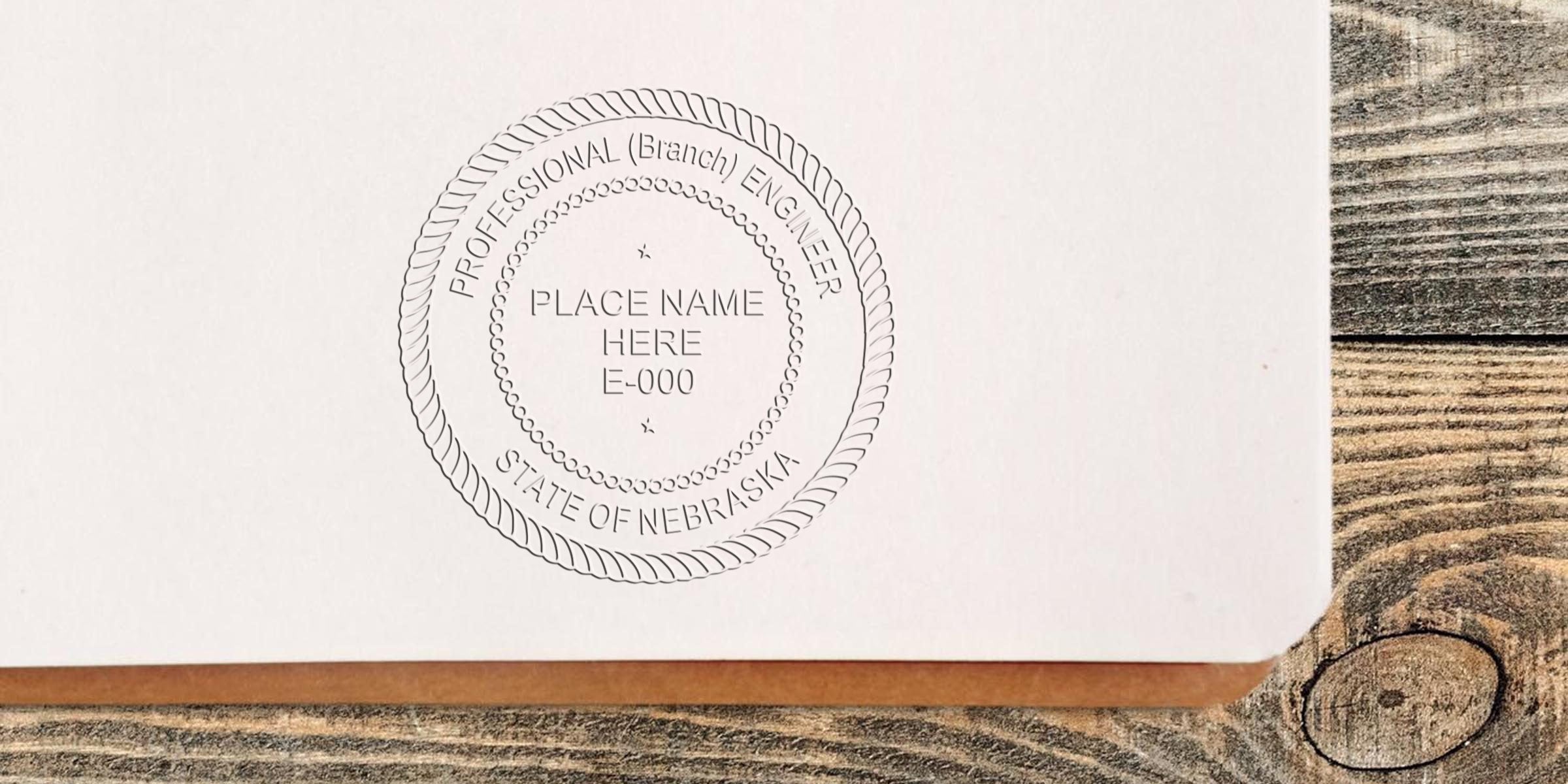 Professional Engineer Stamp Nebraska embossed on white paper on a wooden table, indicating Engineering Project Approval in Nebraska.