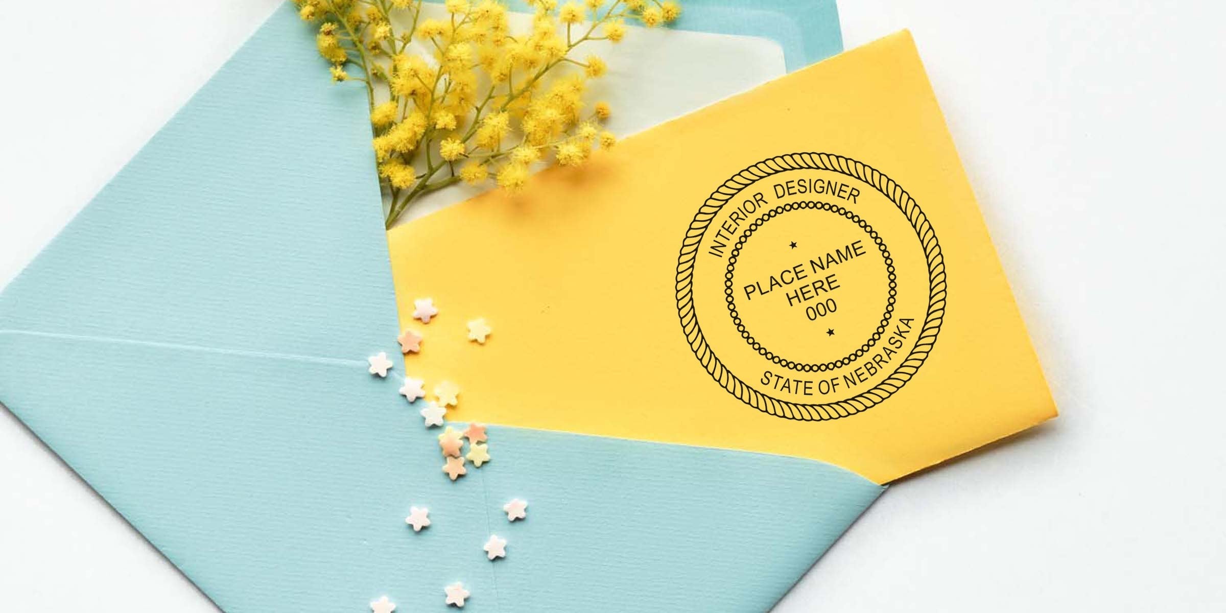 Yellow envelope with Nebraska interior designer stamp and seal, inside a blue envelope adorned with yellow flowers and star confetti; highlighting the cost of the Nebraska interior designer stamp.