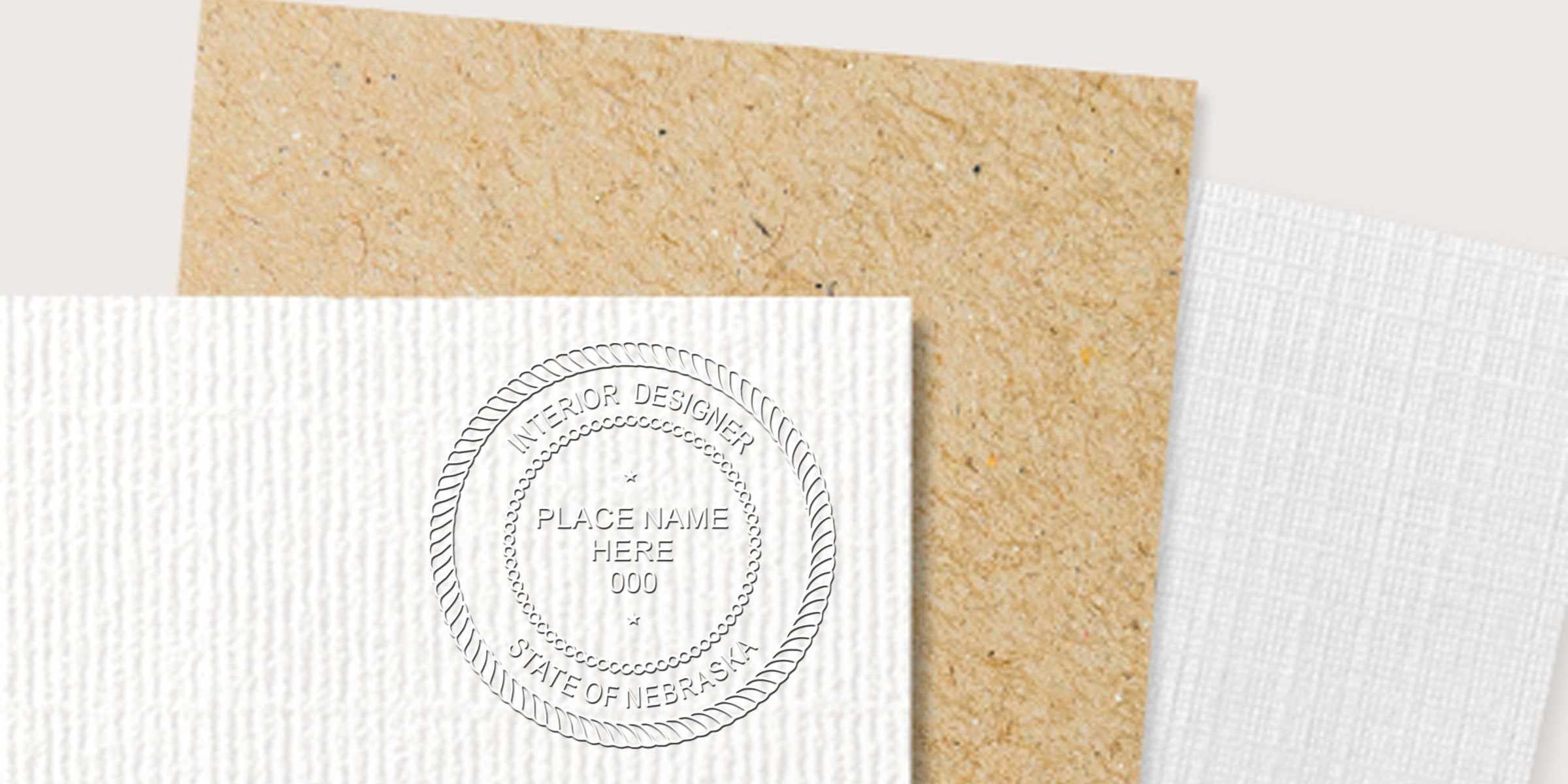 Embossed Nebraska interior designer stamp on textured white paper with kraft paper background, showcasing stamp application requirements.