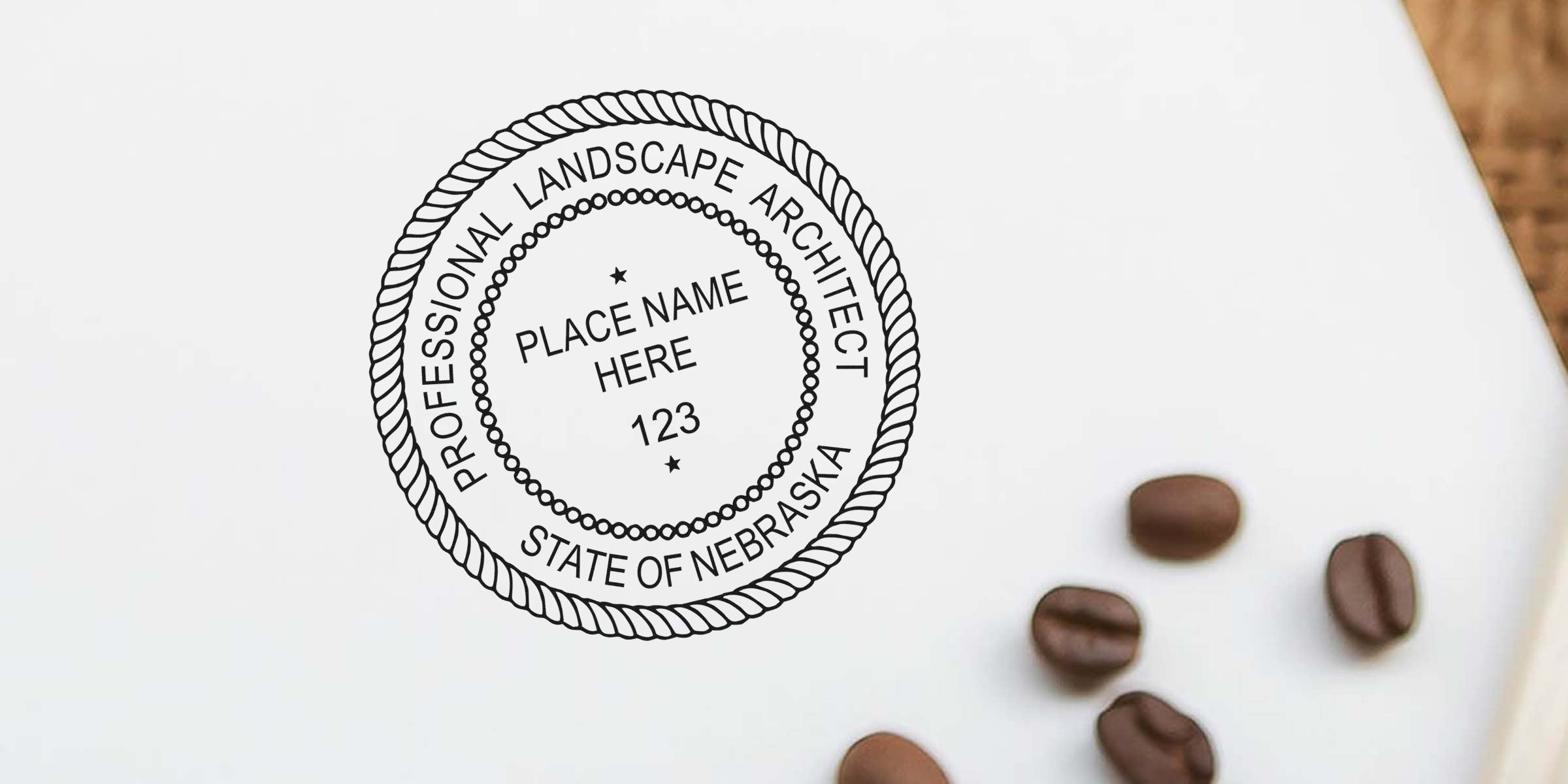 Custom Nebraska landscape architect stamp with a professional seal and coffee beans on white paper, designed as a personalized guide for landscape architects.