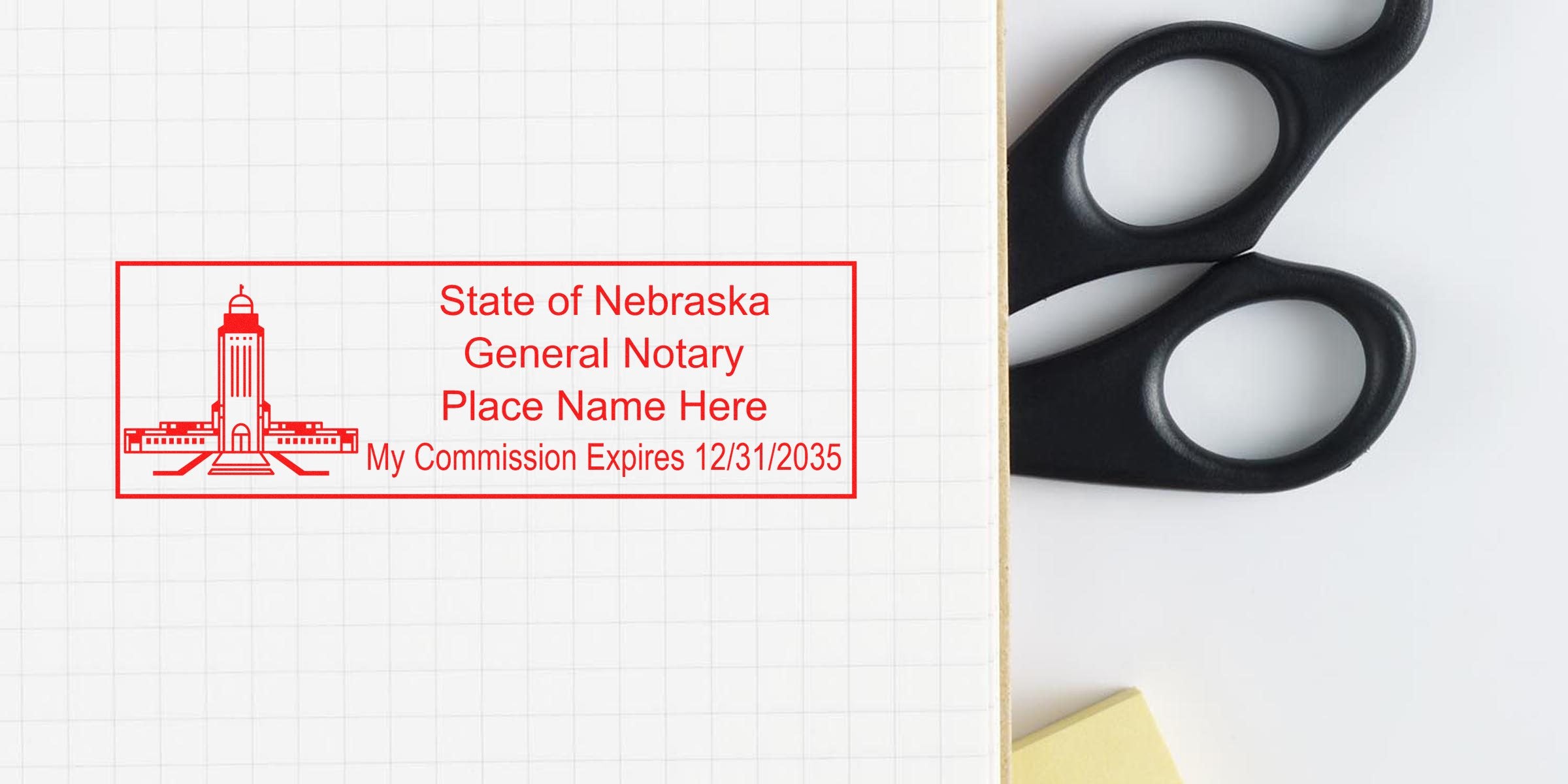 Nebraska notary stamp with commission expiry and general text on grid paper, next to black scissors and yellow sticky notes, displaying key Nebraska notary supplies and tools.